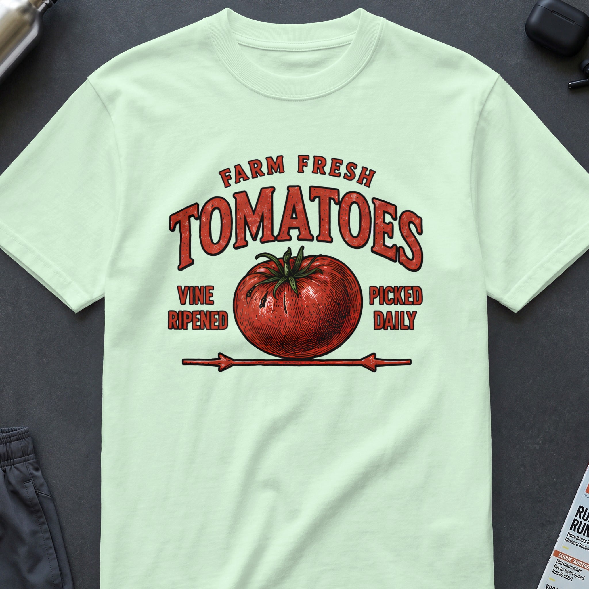 Light green t-shirt with a vintage "Farm Fresh Tomatoes" graphic.