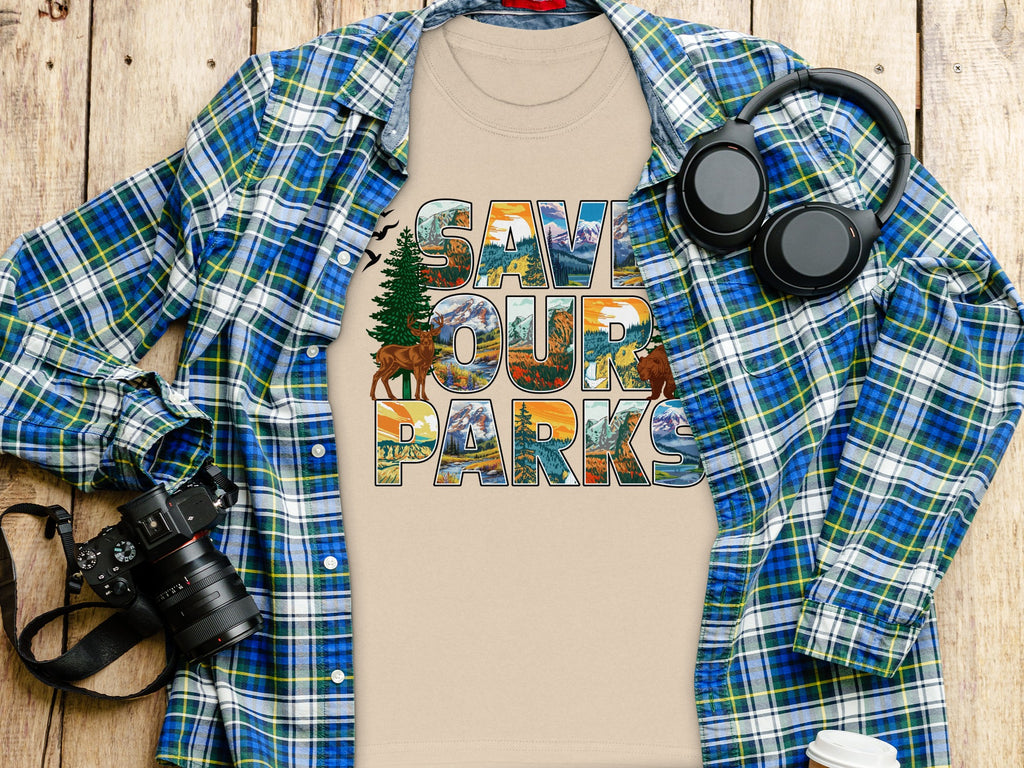 T-shirt with "Save Our Parks" text filled with mountain and nature scenes.