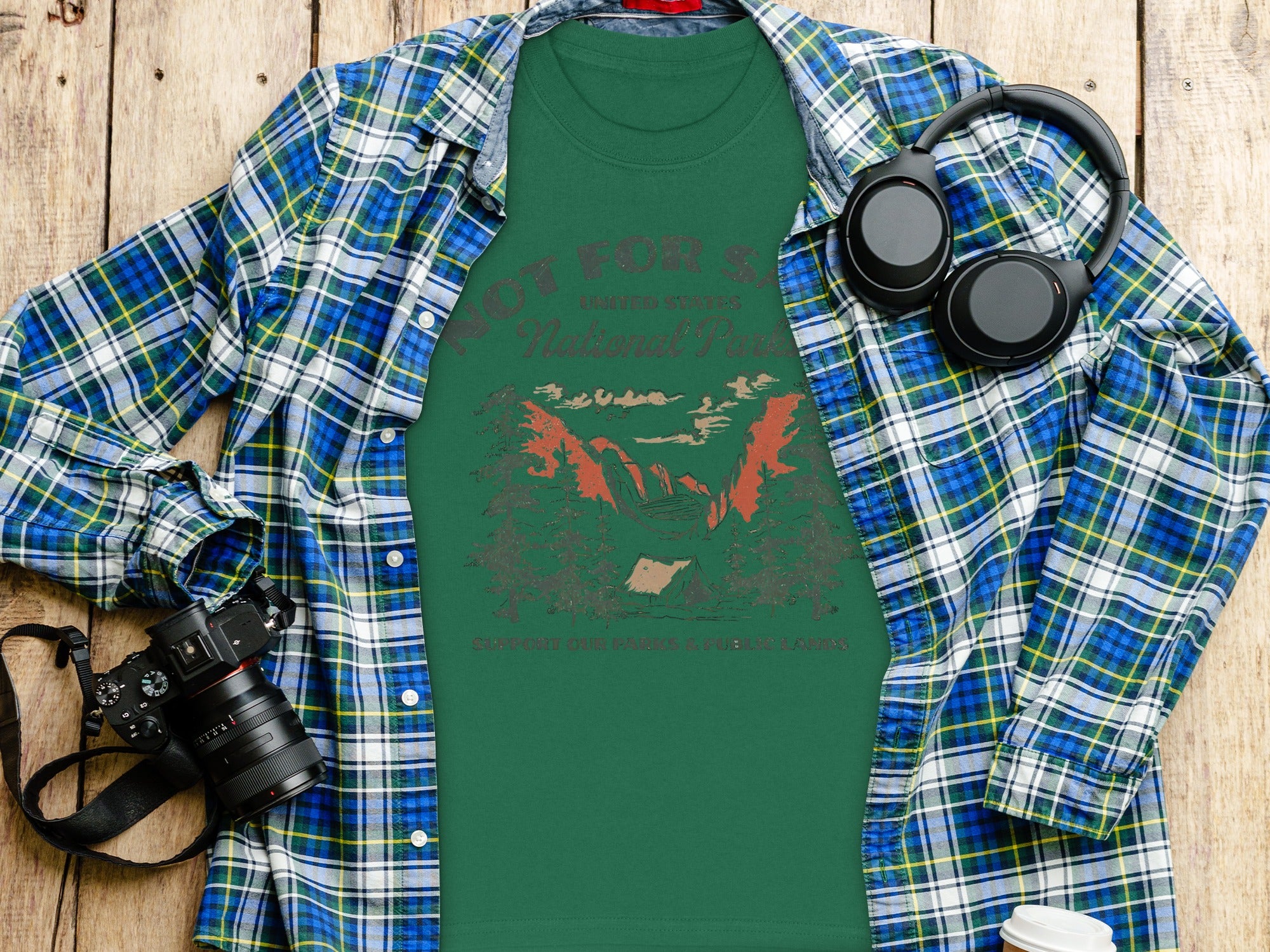 Green t-shirt with "Not For S. National Park" text and mountain scene.
