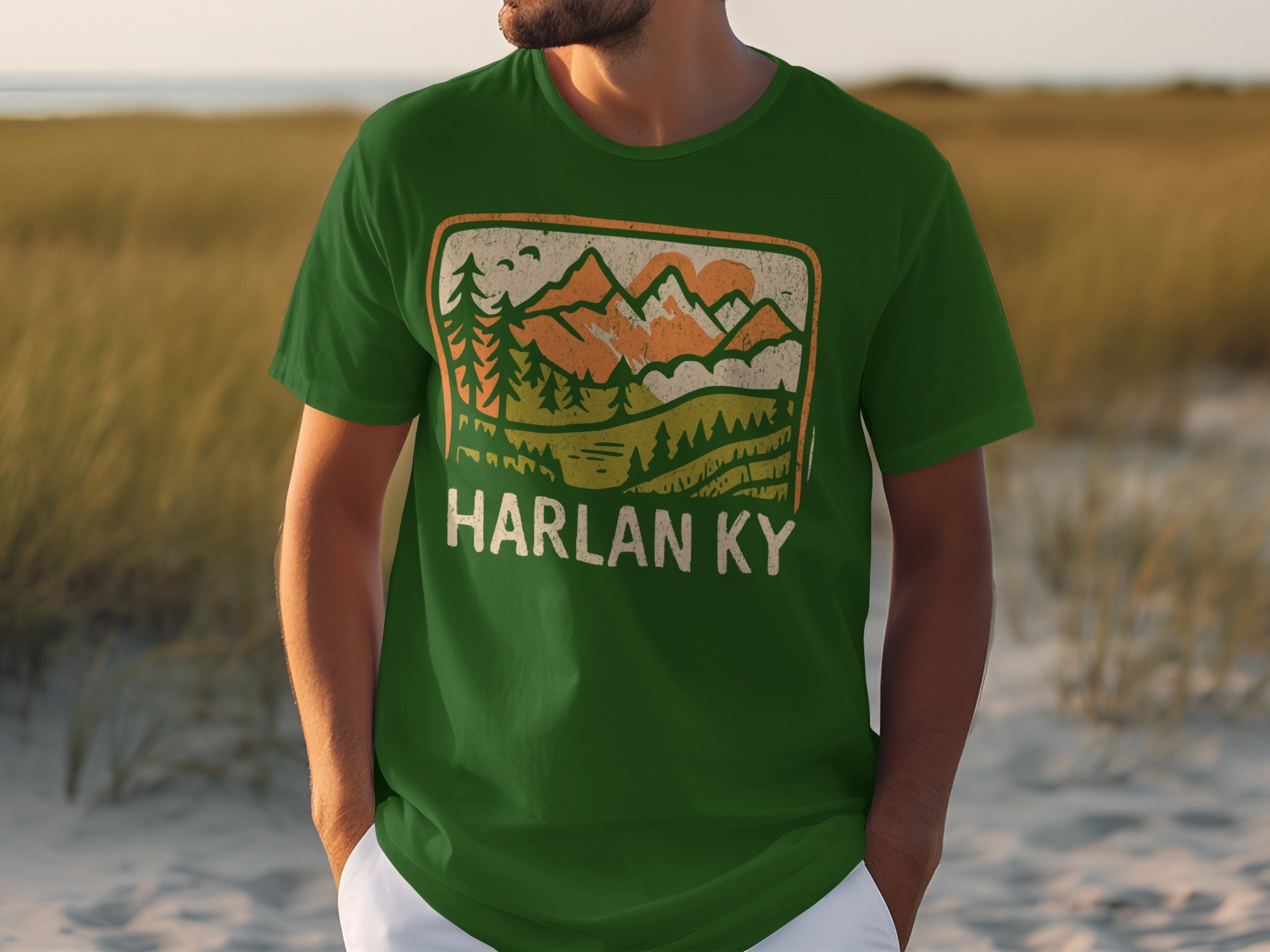 Green t-shirt with "HARLAN KY" and mountain graphic.