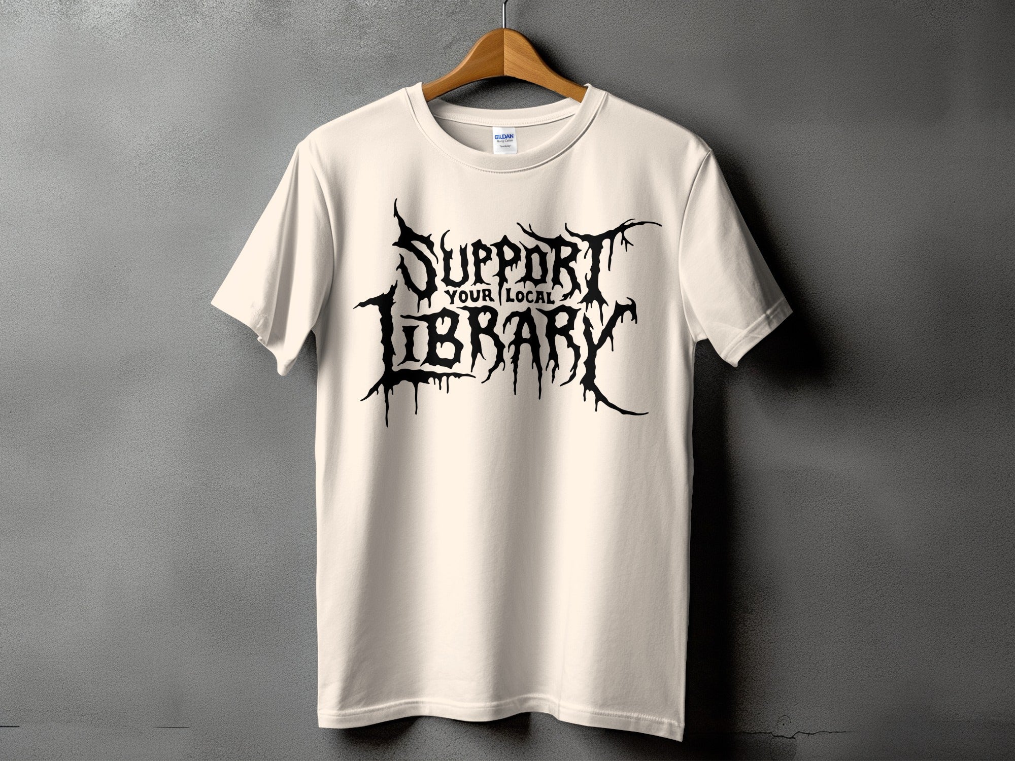 Light cream t-shirt with black distressed text "Support Your Local Library".