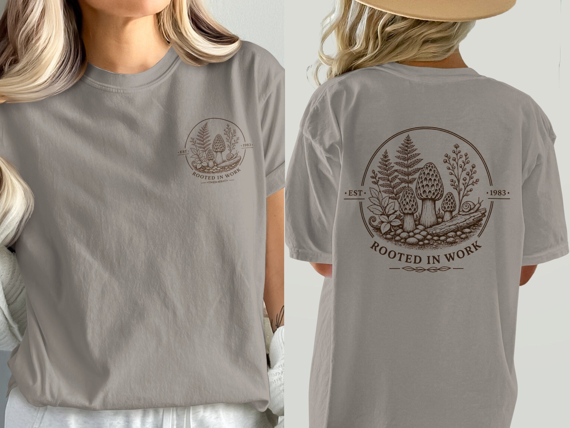 Taupe t-shirt with a brown circular graphic featuring mushrooms, ferns, and text "ROOTED IN WORK EST. 1983."