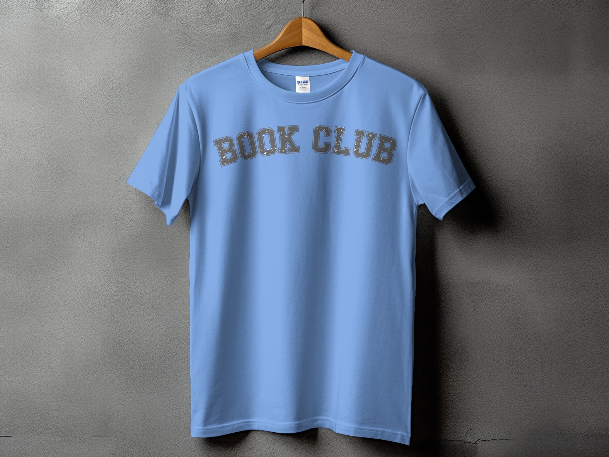 Light blue t-shirt with distressed gray "BOOK CLUB" lettering across the chest.