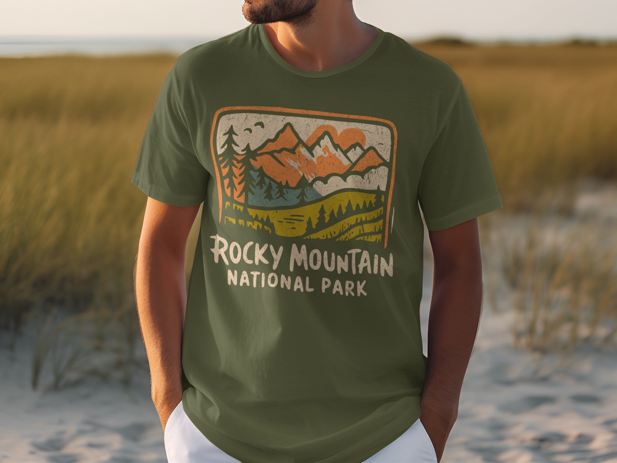 Green t-shirt with Rocky Mountain National Park graphic featuring mountains and trees.