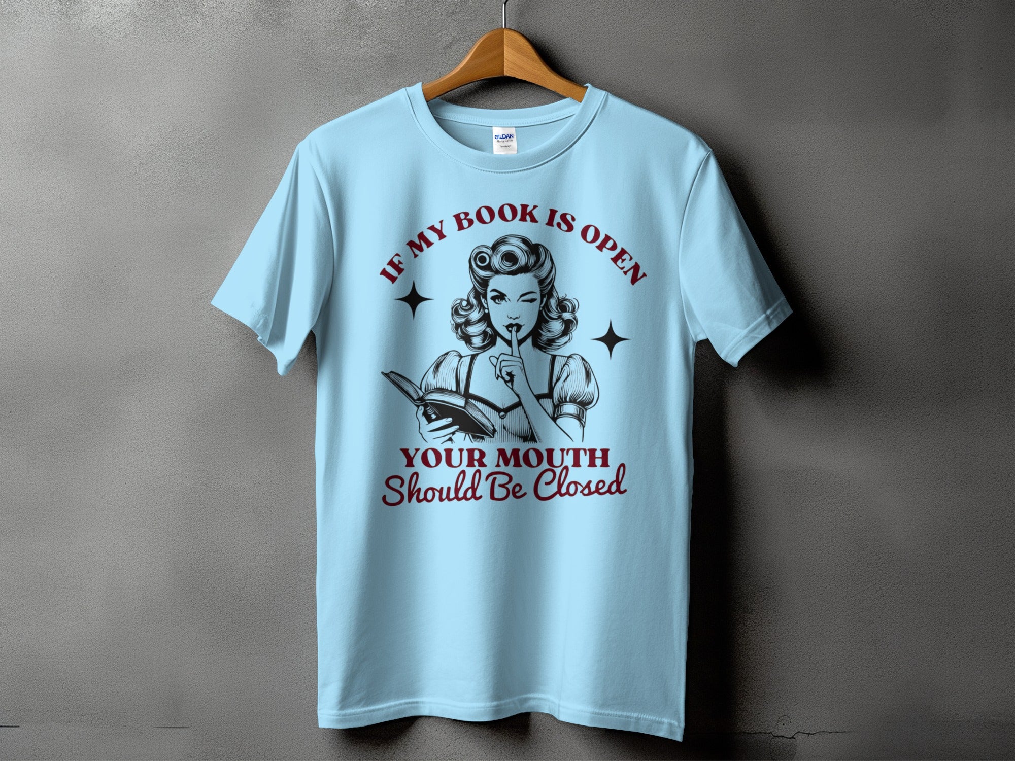 Light blue t-shirt with design "If My Book Is Open Your Mouth Should Be Closed."
