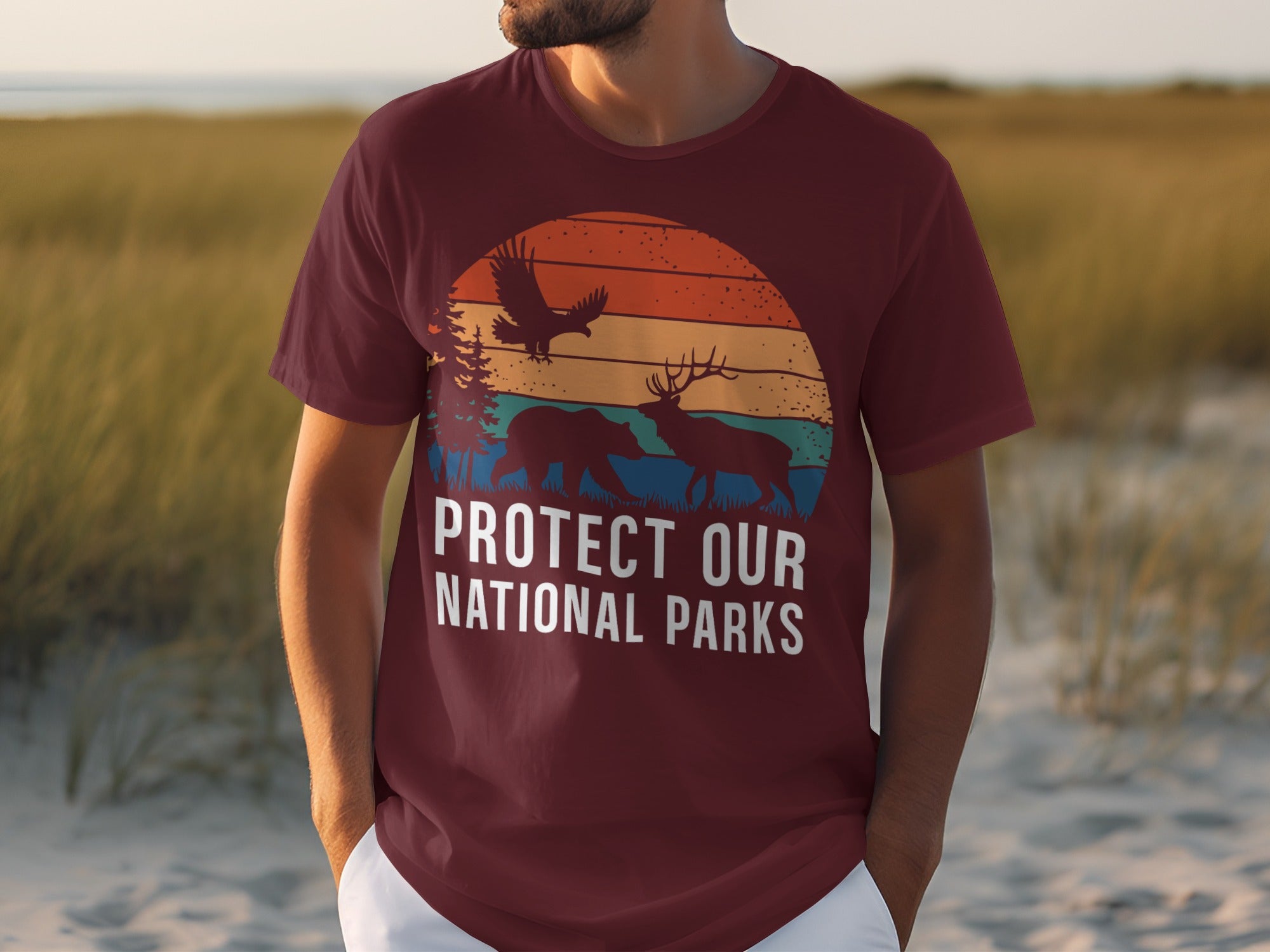Maroon t-shirt with "Protect Our National Parks" text and wildlife graphic.