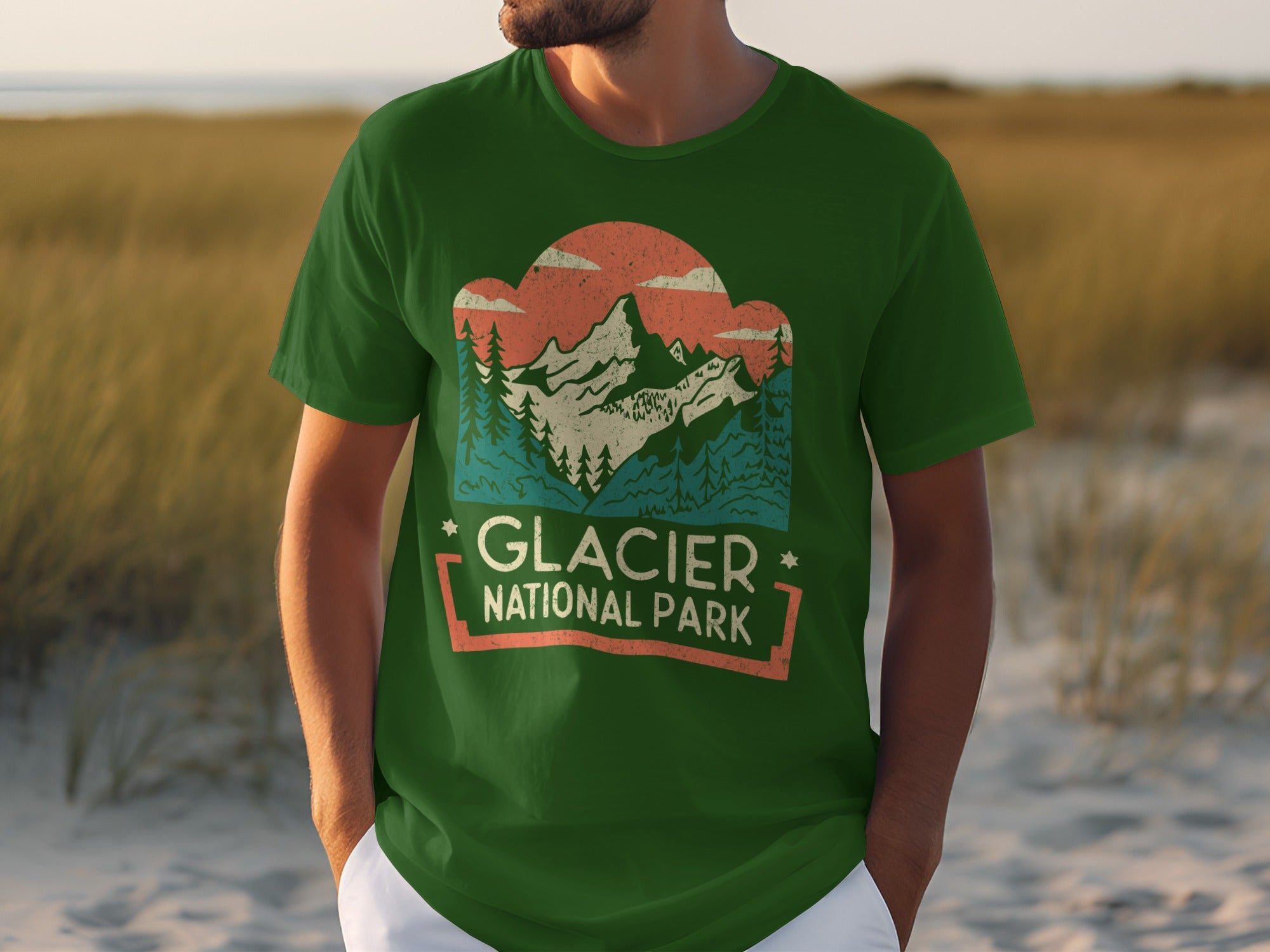 Green t-shirt with Glacier National Park mountain landscape graphic.