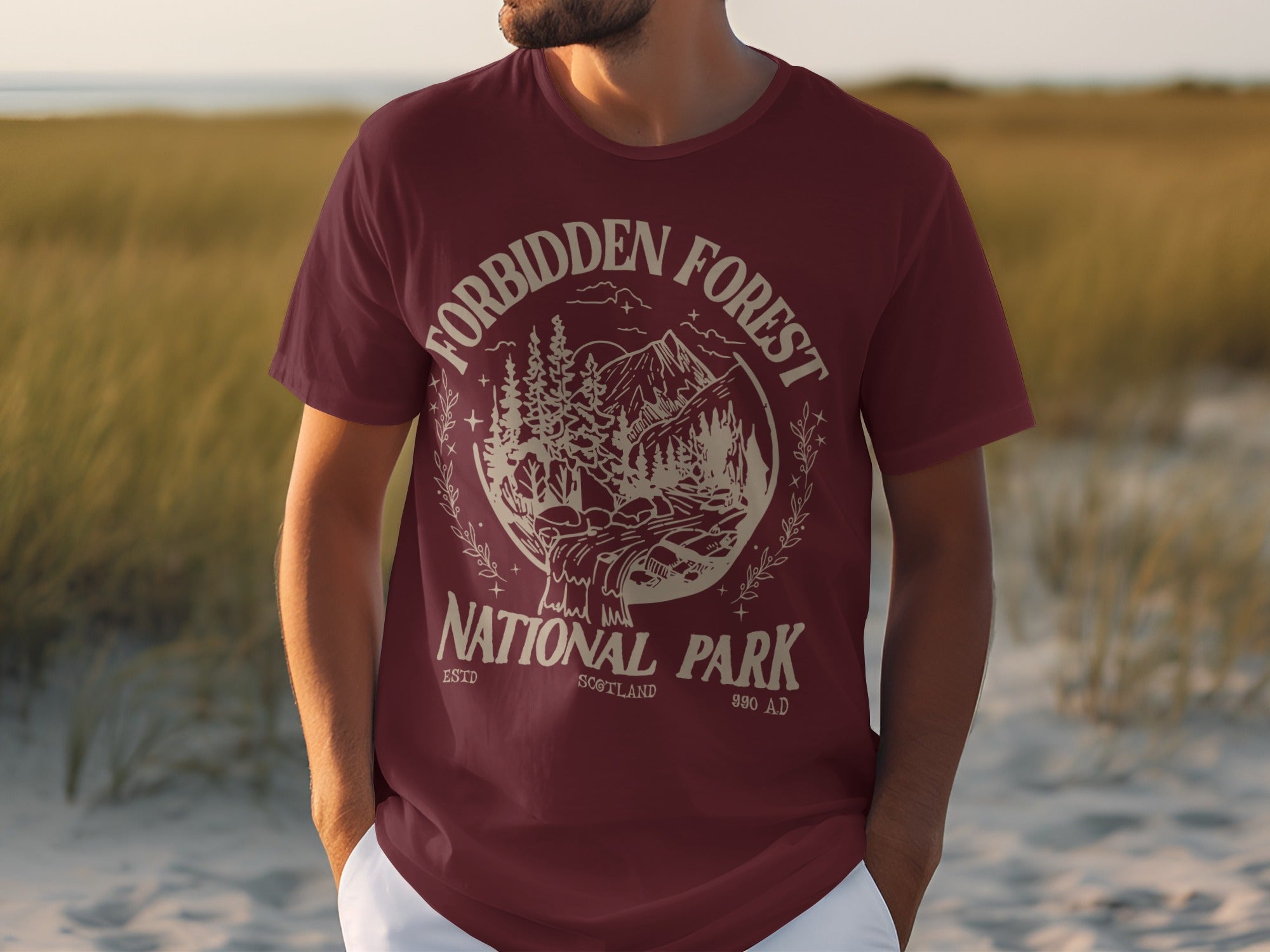 Maroon t-shirt with "Forbidden Forest National Park Scotland 990 AD" graphic.