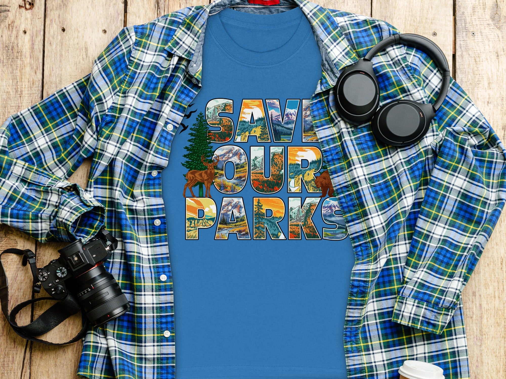 Blue t-shirt with "Save Our Parks" text featuring nature scenes, deer, and bear.