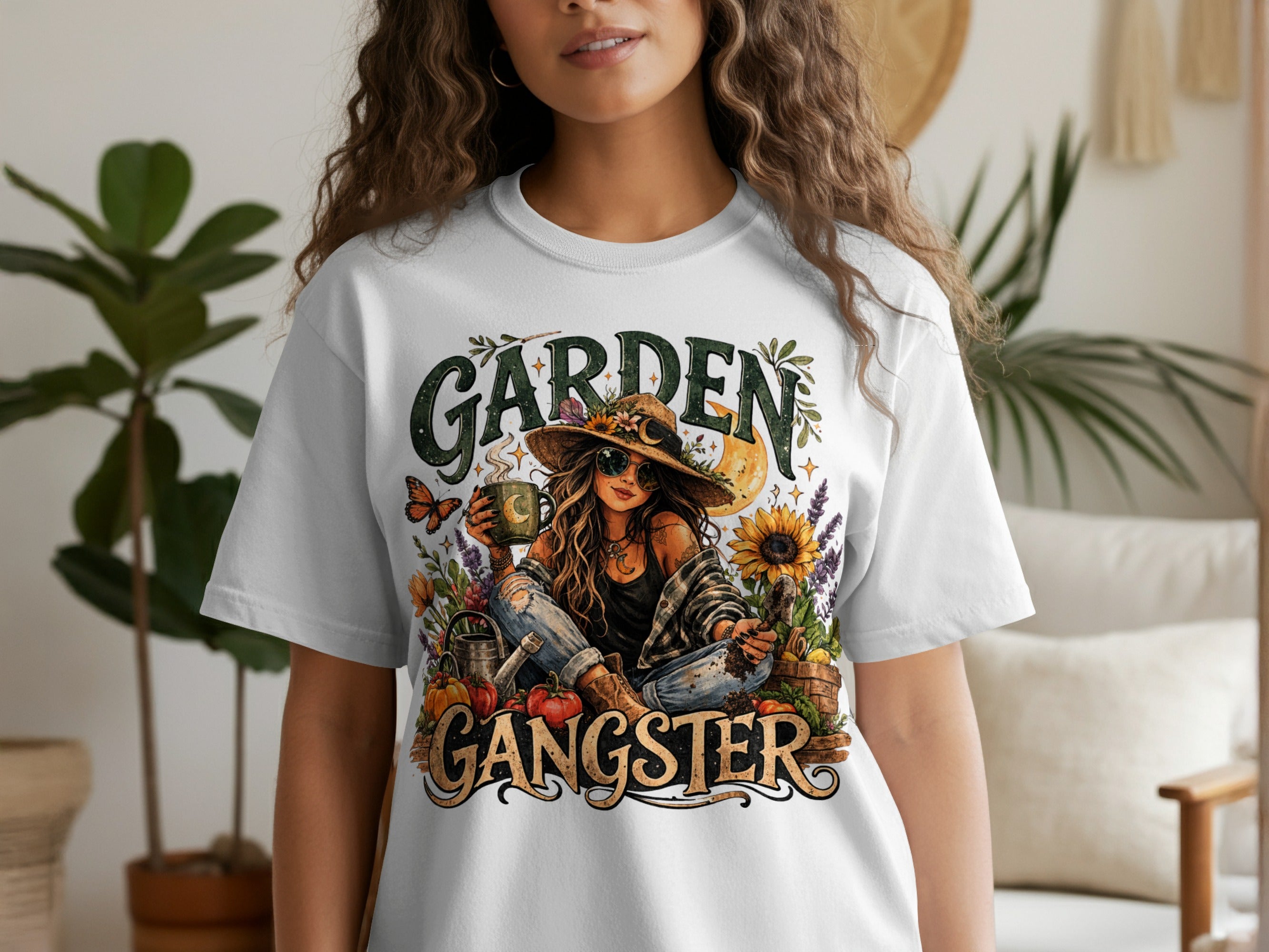 White t-shirt with "Garden Gangster" text and illustration of a woman with gardening elements.