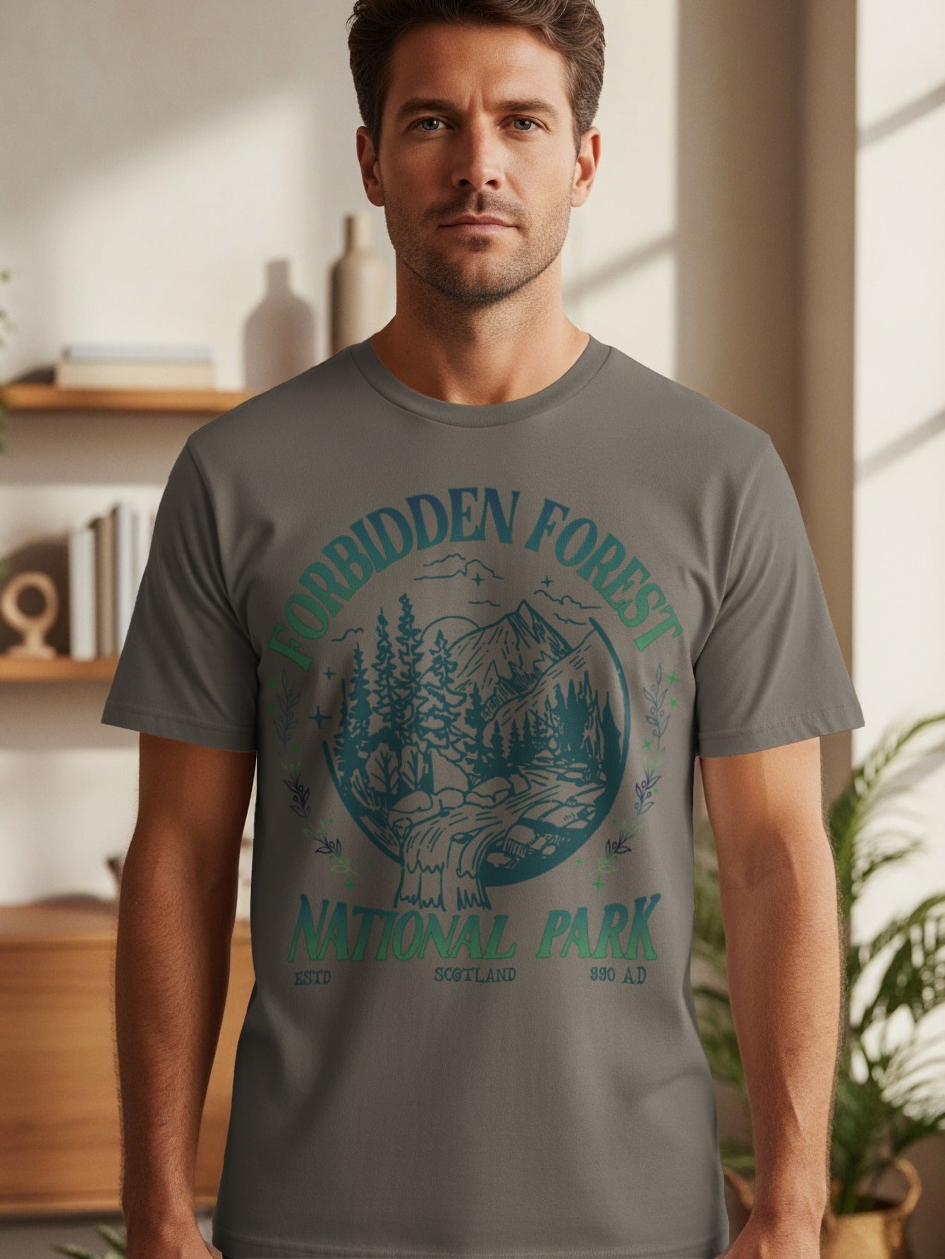 Men's grey t-shirt with "Forbidden Forest National Park Scotland 990 AD" print.