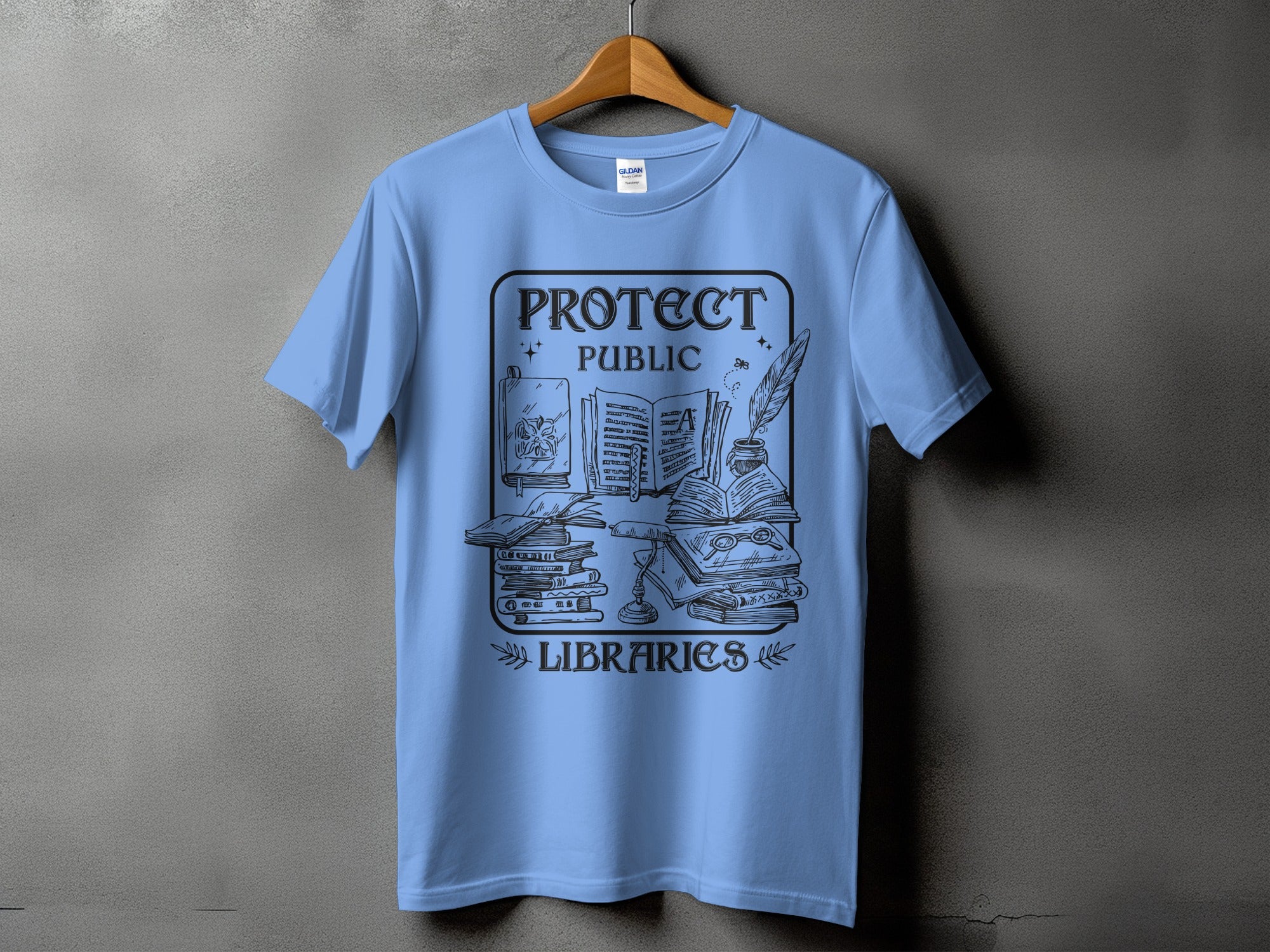 Light blue t-shirt with black graphic text "PROTECT PUBLIC LIBRARIES" and book illustrations.