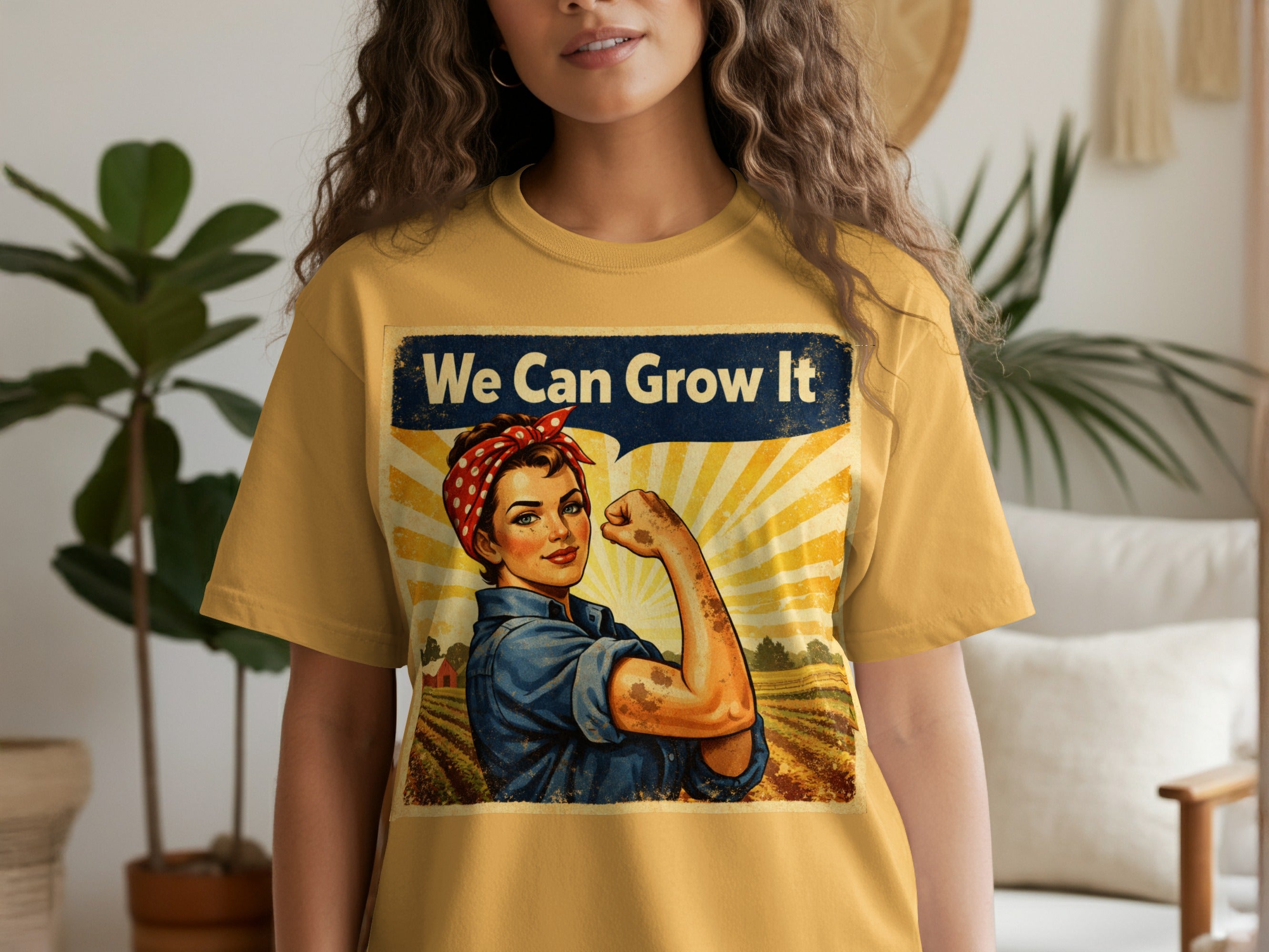 Rosie the Riveter graphic with text "We Can Grow It" on a yellow t-shirt.
