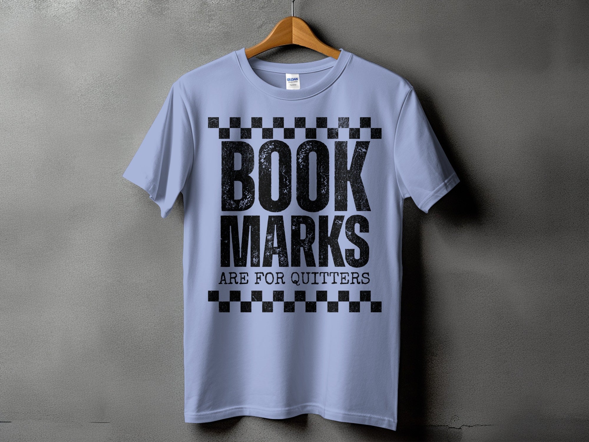Light blue t-shirt with black text "BOOK MARKS ARE FOR QUITTERS"