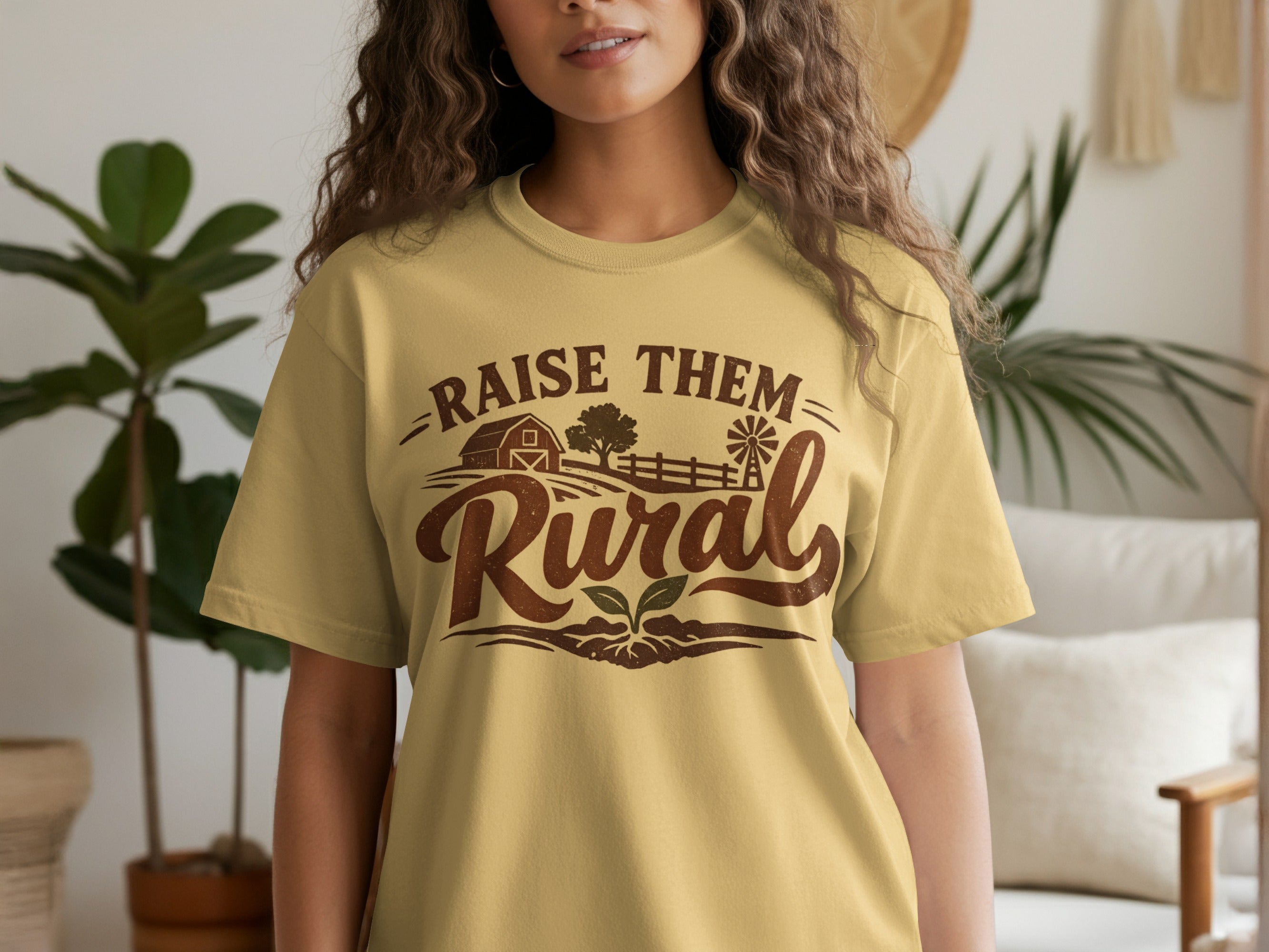Yellow t-shirt with "Raise Them Rural" text and farm graphics.
