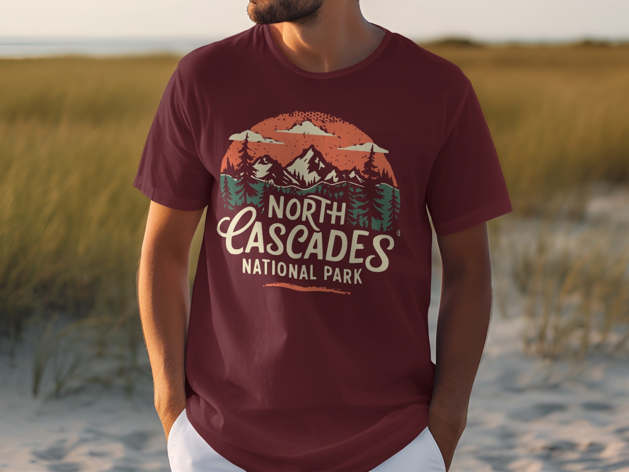 Maroon t-shirt with vintage North Cascades National Park mountain graphic.