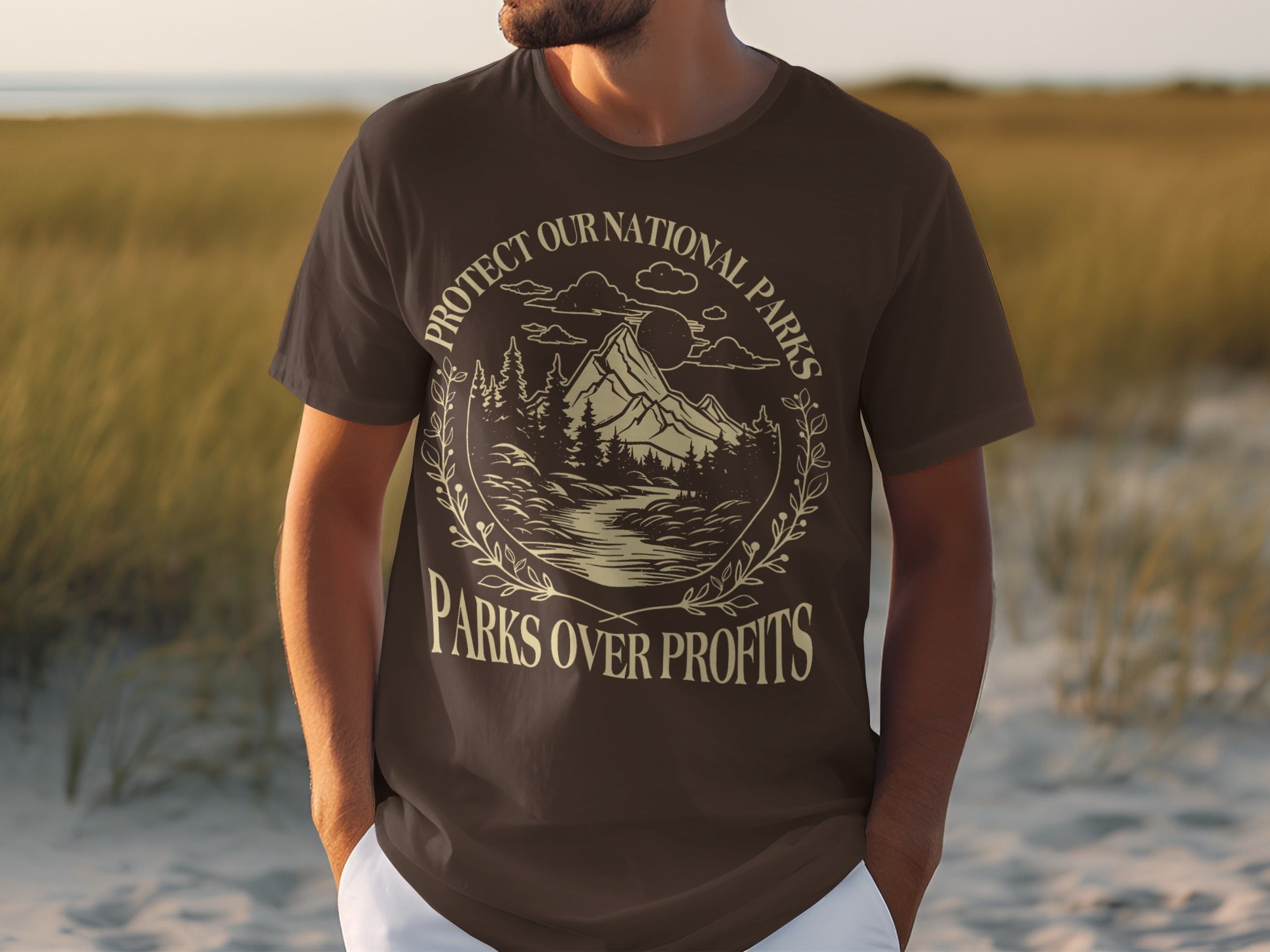 Brown t-shirt with "Protect Our National Parks" and "Parks Over Profits" text.