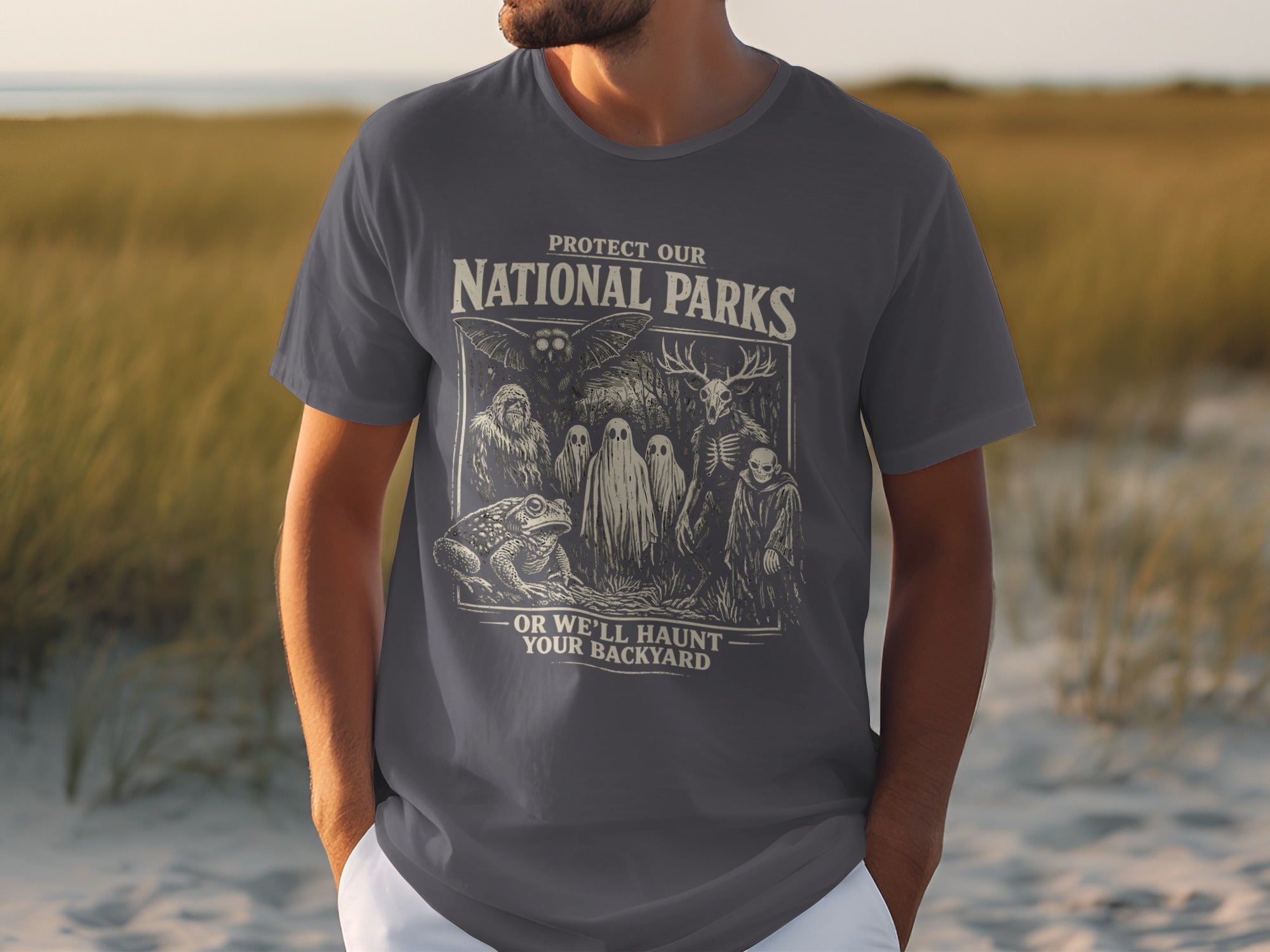 Dark grey t-shirt with "Protect Our National Parks" and spooky creatures.