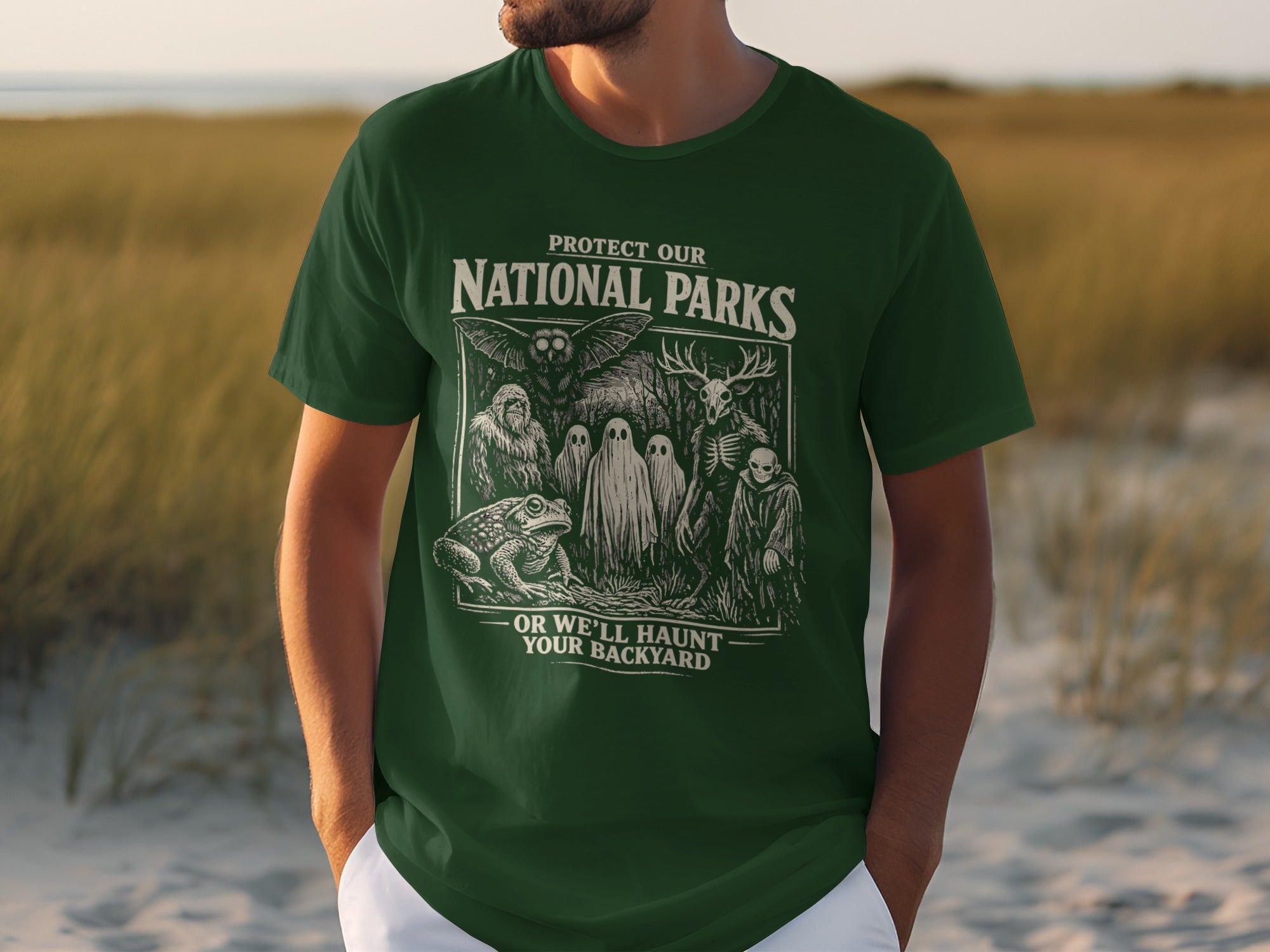 Green T-shirt with graphic: Protect Our National Parks or We'll Haunt Your Backyard.