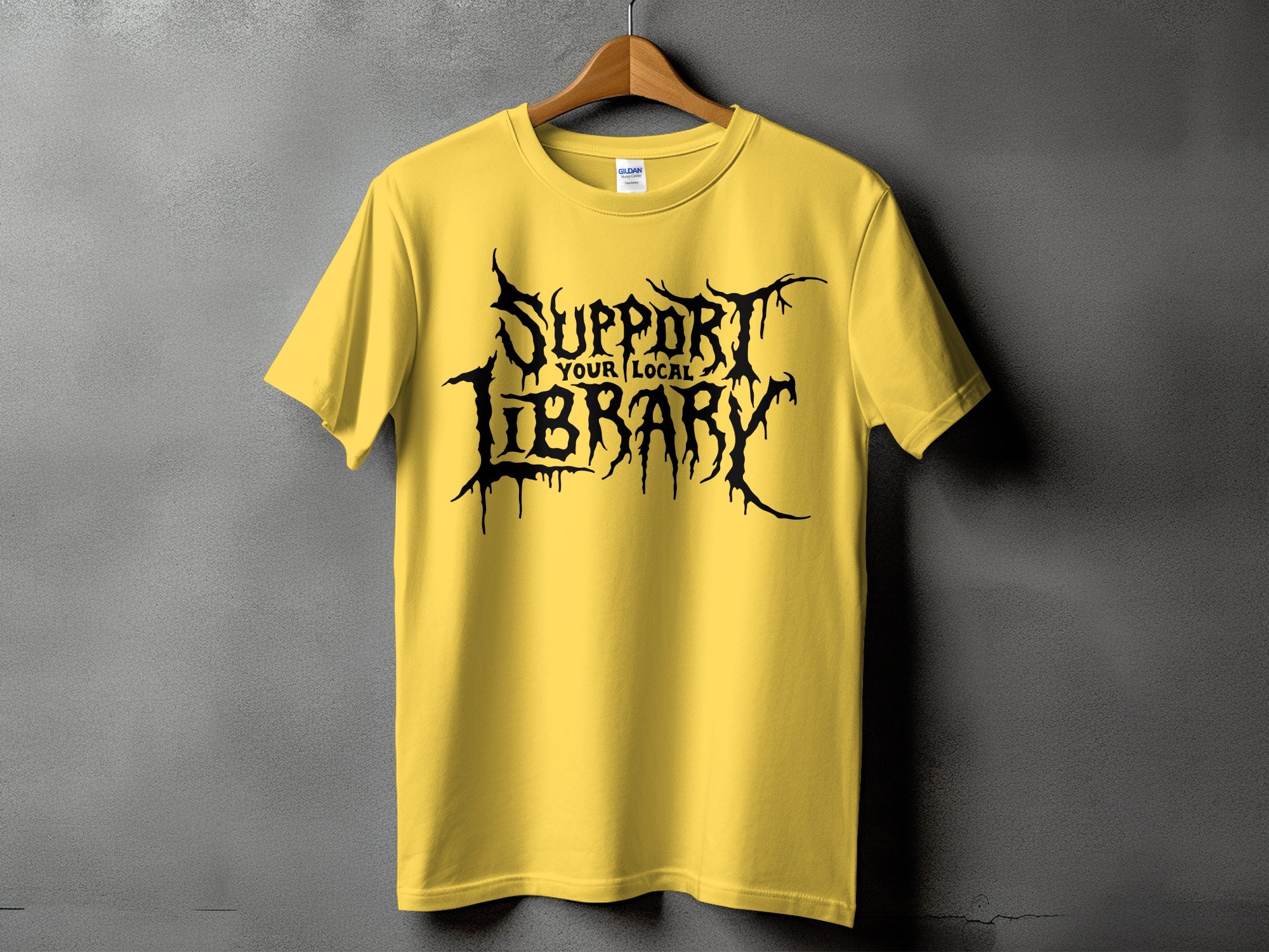Yellow t-shirt with black gothic text that reads "Support Your Local Library".