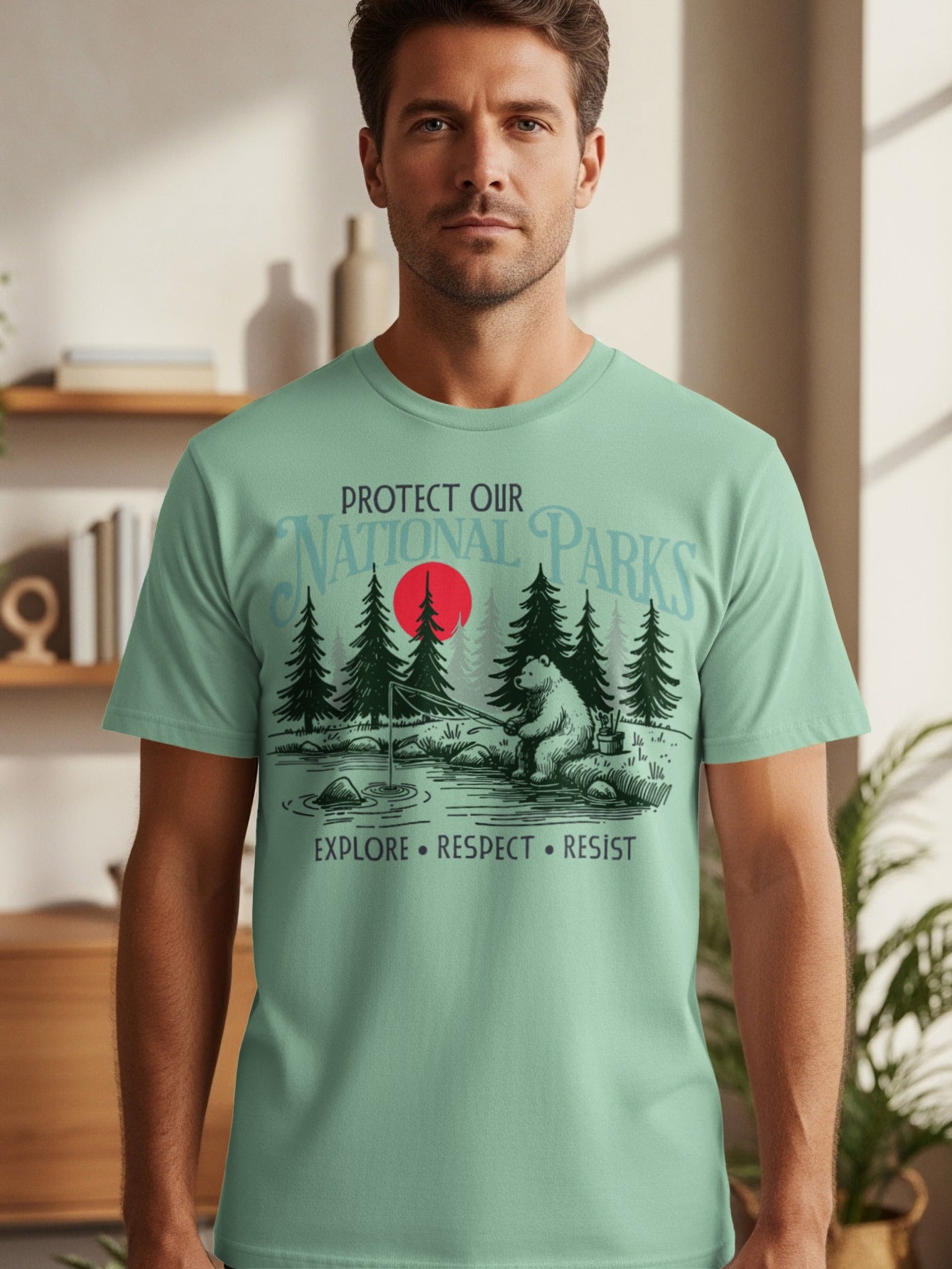 T-shirt graphic "Protect Our National Parks" with bear fishing, red sun, and trees.