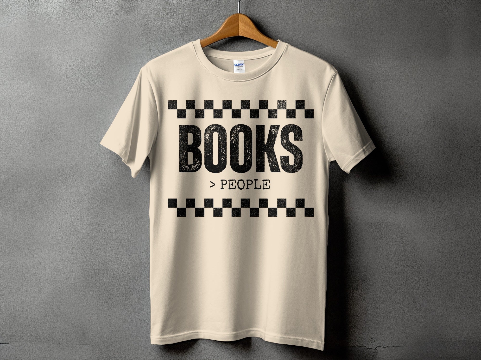 Cream t-shirt with black "BOOKS > PEOPLE" text and checkered border detail