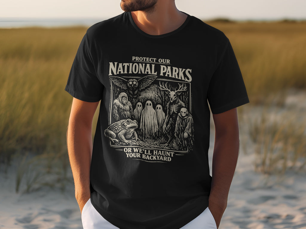 Black t-shirt with "Protect Our National Parks" and spooky forest creatures design.