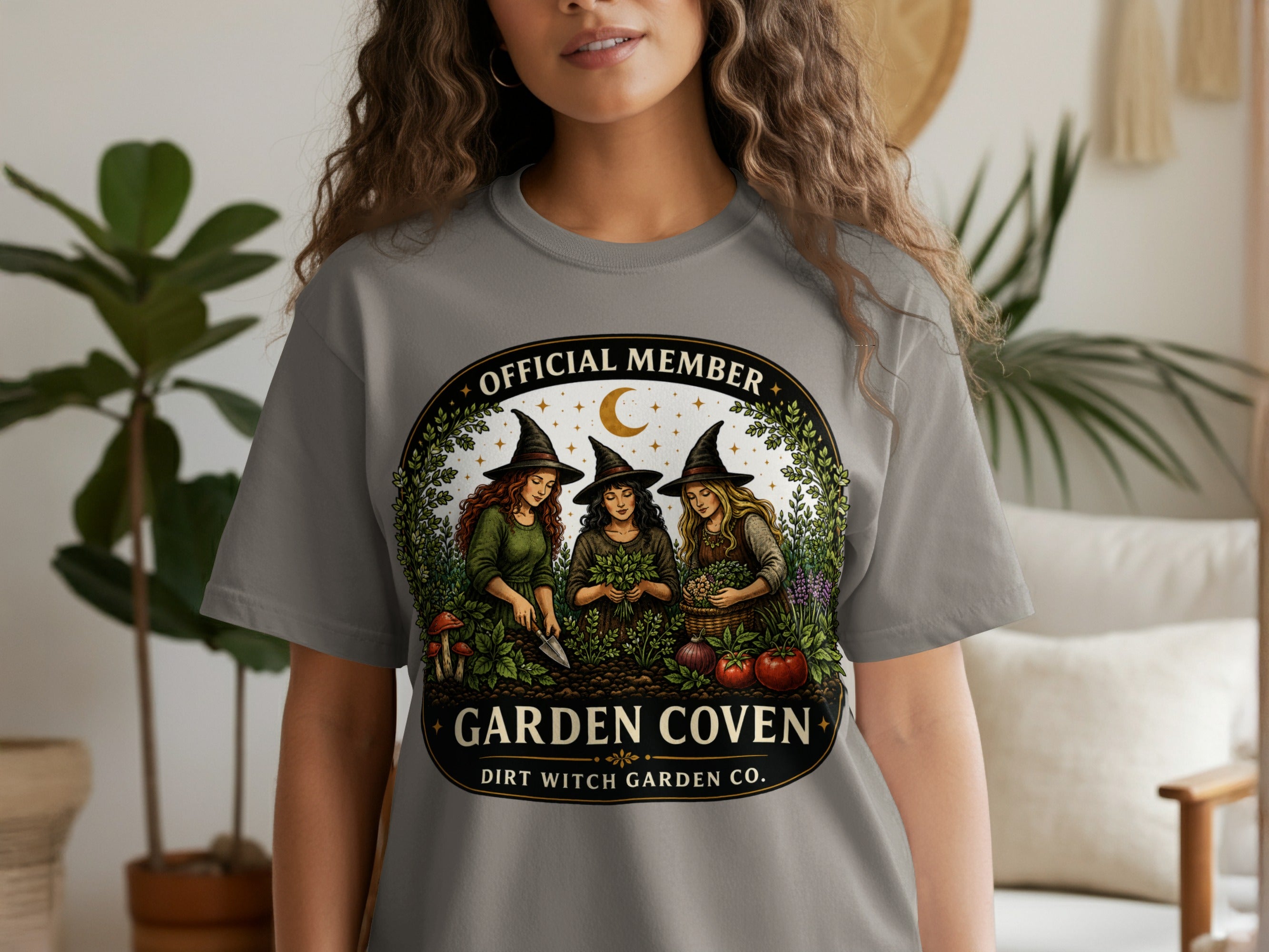 Official Member Garden Coven Dirt Witch Garden Co. graphic on a gray t-shirt.