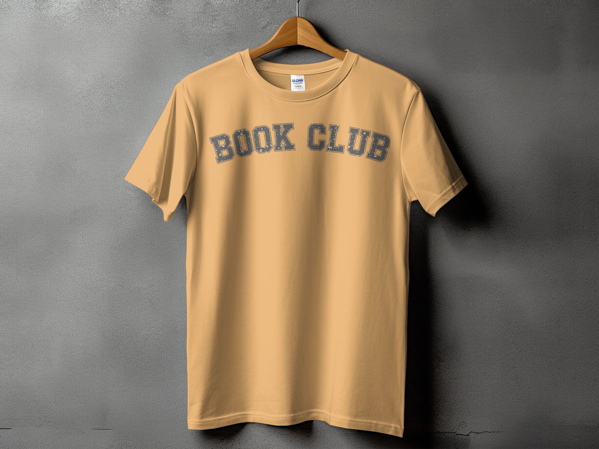 Peach t-shirt with "BOOK CLUB" text in distressed grey collegiate font.