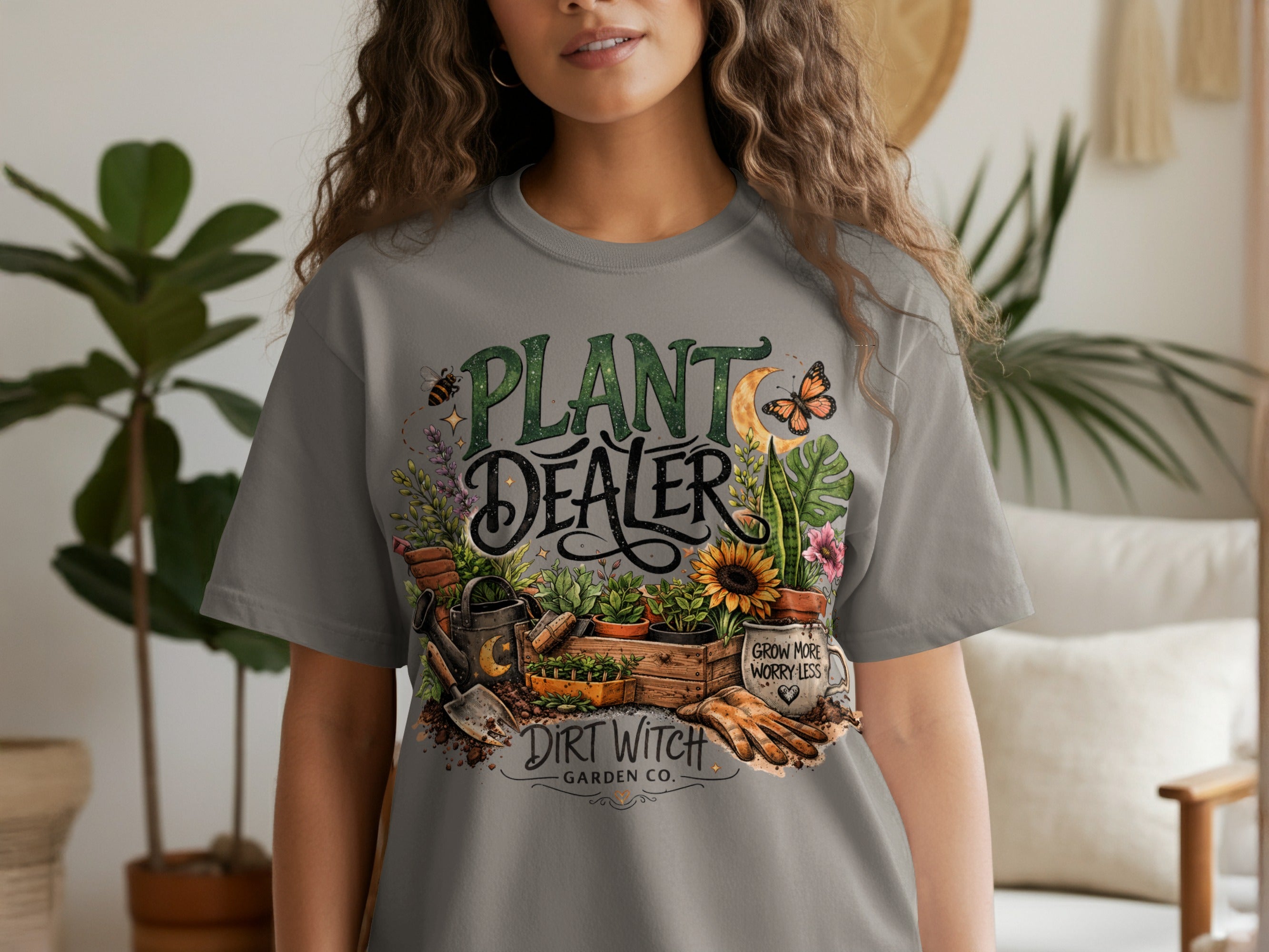 Grey t-shirt with "PLANT DEALER DIRT WITCH GARDEN CO." and gardening imagery.