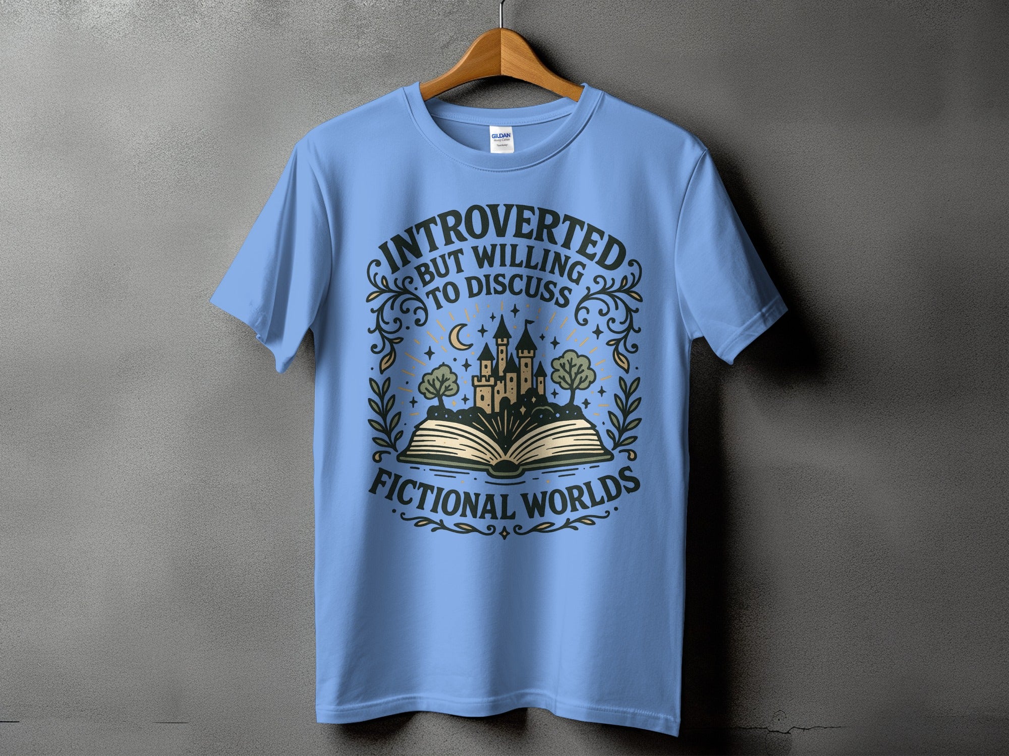 Light blue t-shirt with "Introverted but willing to discuss fictional worlds" text and castle graphic.