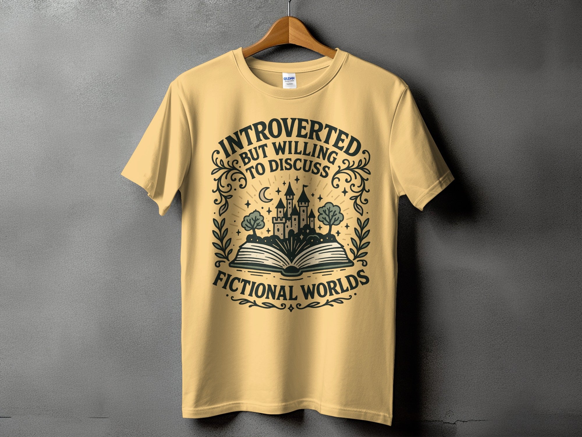 Yellow t-shirt with "Introverted but willing to discuss fictional worlds" text and castle graphic.