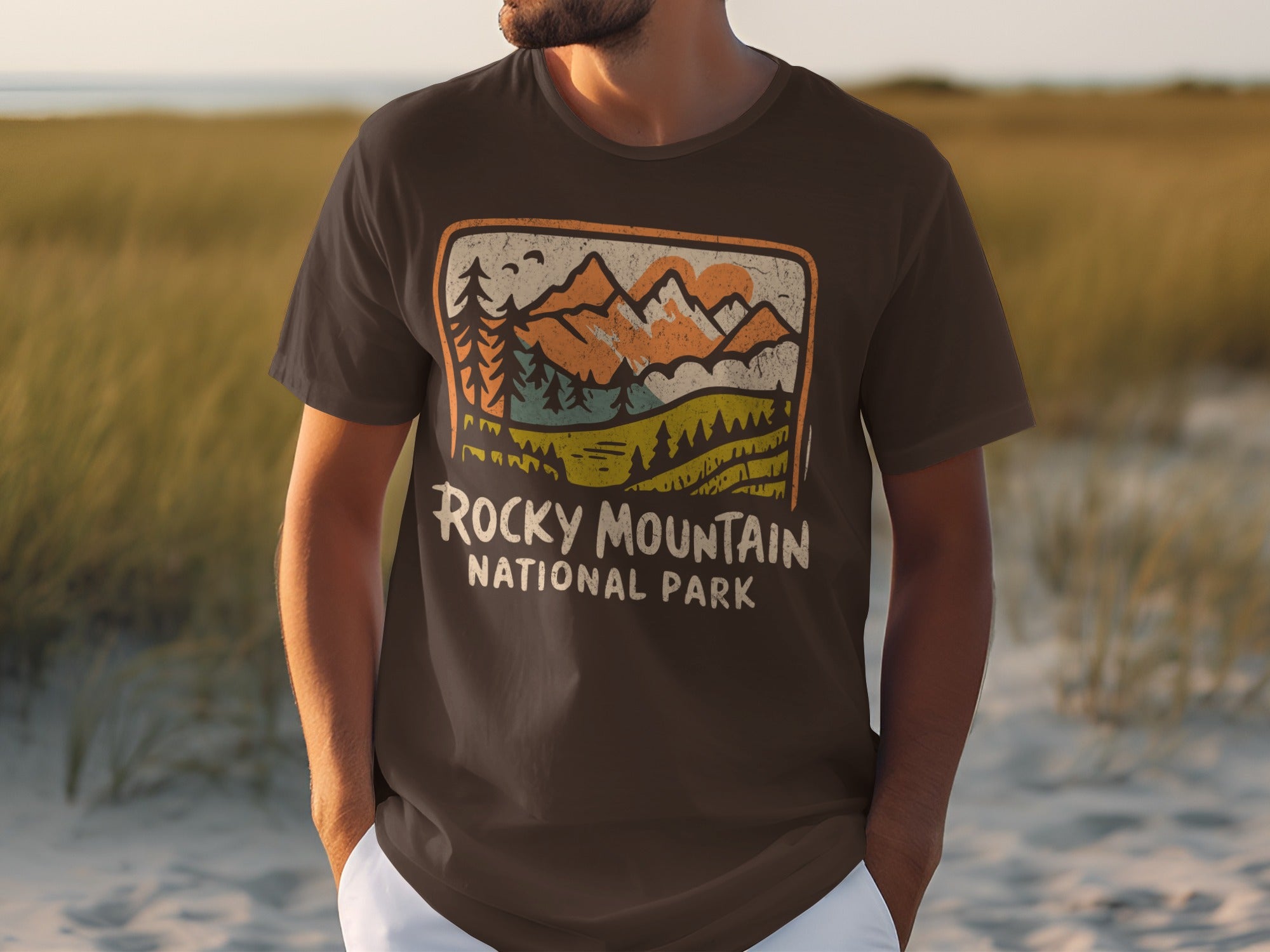Brown t-shirt with Rocky Mountain National Park graphic featuring mountains, trees, and sun.