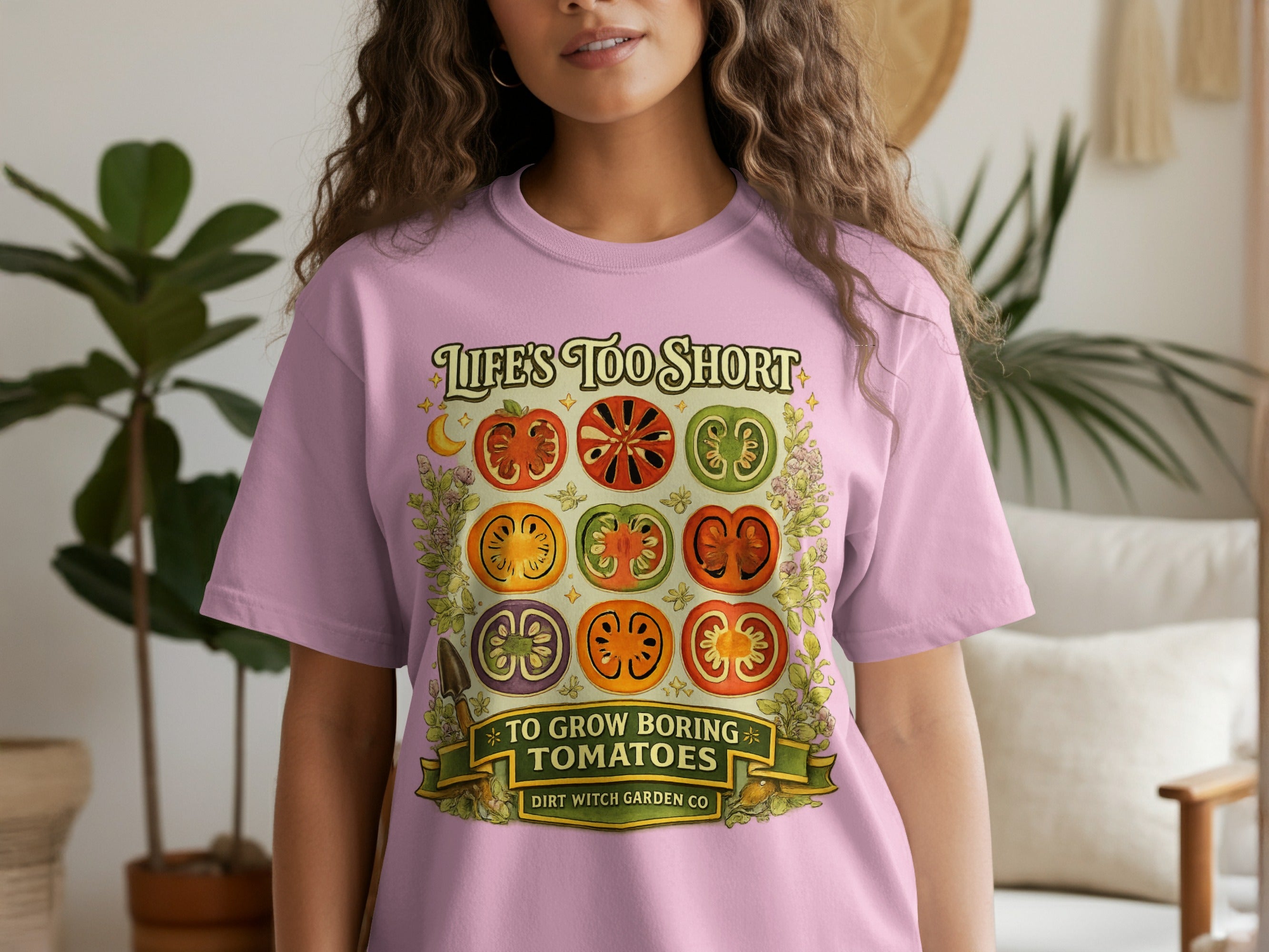 Pink t-shirt with illustration of sliced tomatoes and text "Life's Too Short To Grow Boring Tomatoes".