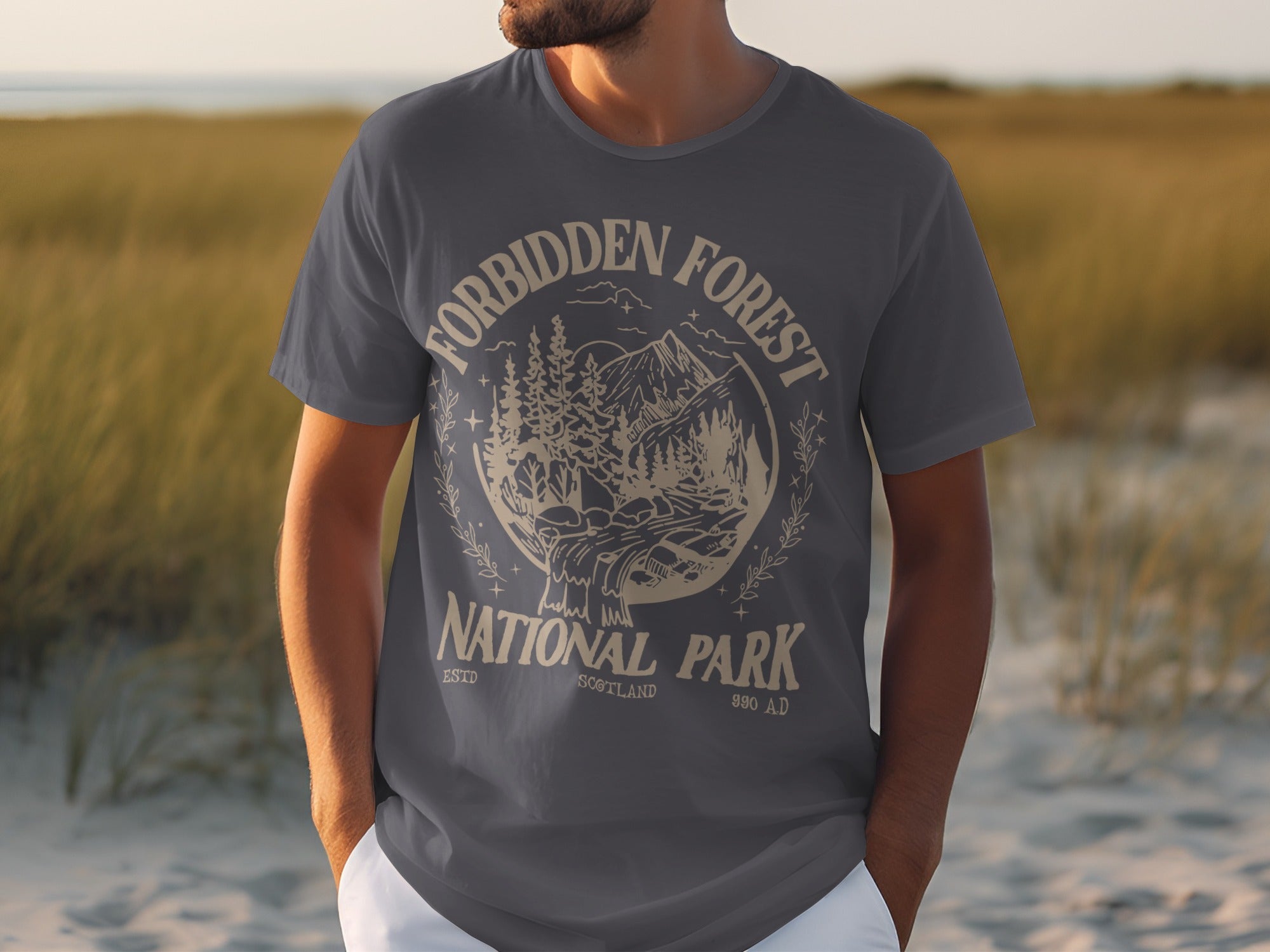 Grey t-shirt with "Forbidden Forest National Park" and a mountain landscape graphic.