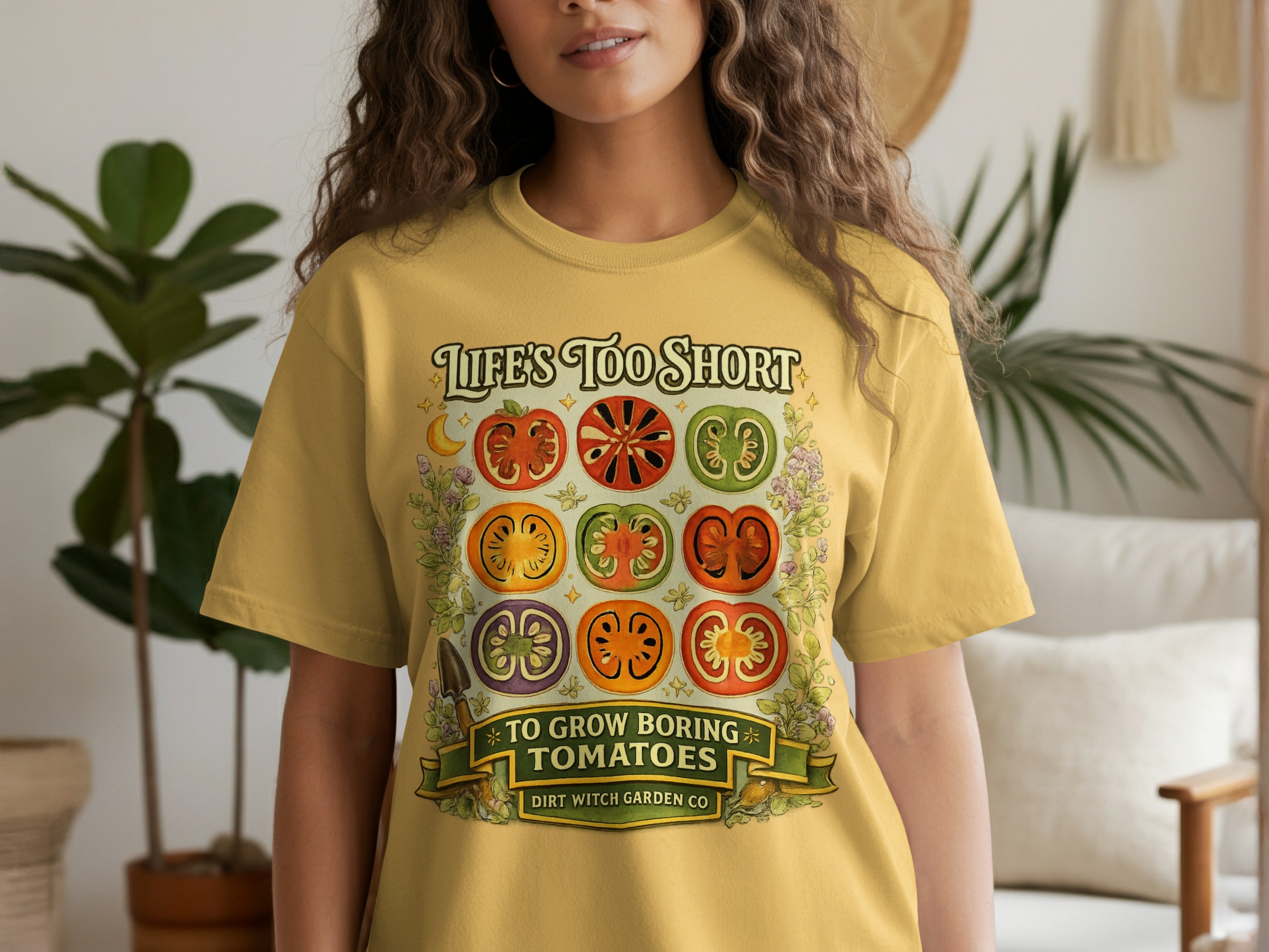 T-shirt with a graphic of sliced tomatoes and text "Life's Too Short To Grow Boring Tomatoes."