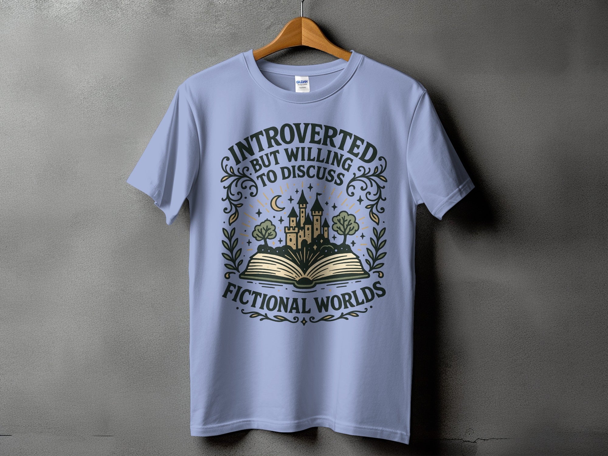 Light blue t-shirt with "Introverted but willing to discuss fictional worlds" text and castle graphic.