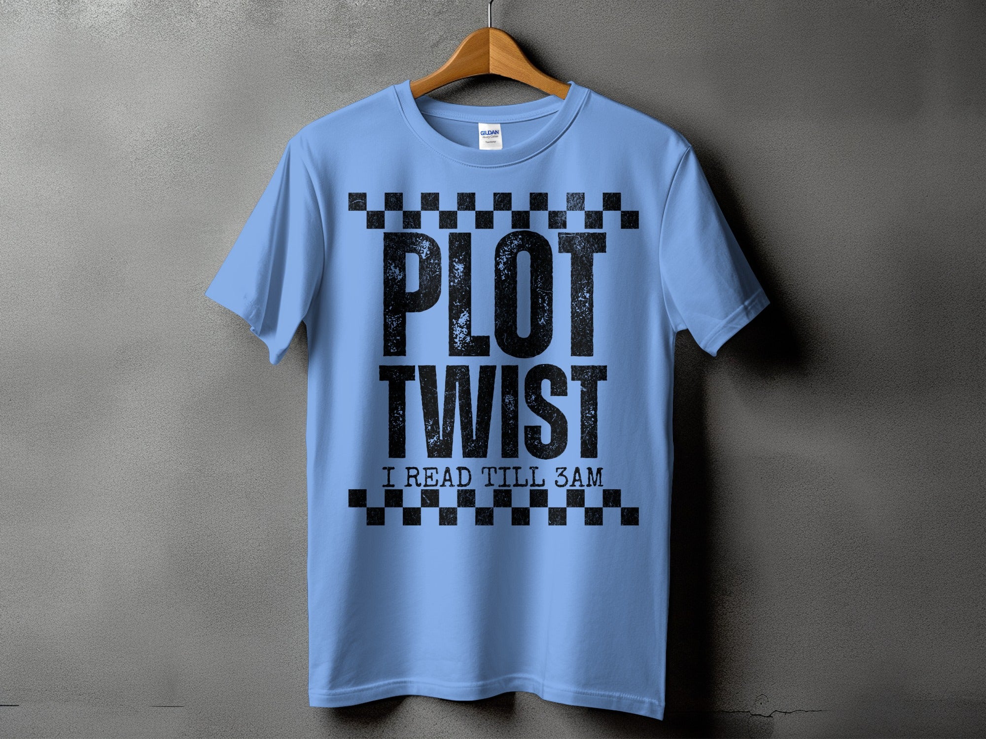 Light blue t-shirt with black text "PLOT TWIST I READ TILL 3AM".