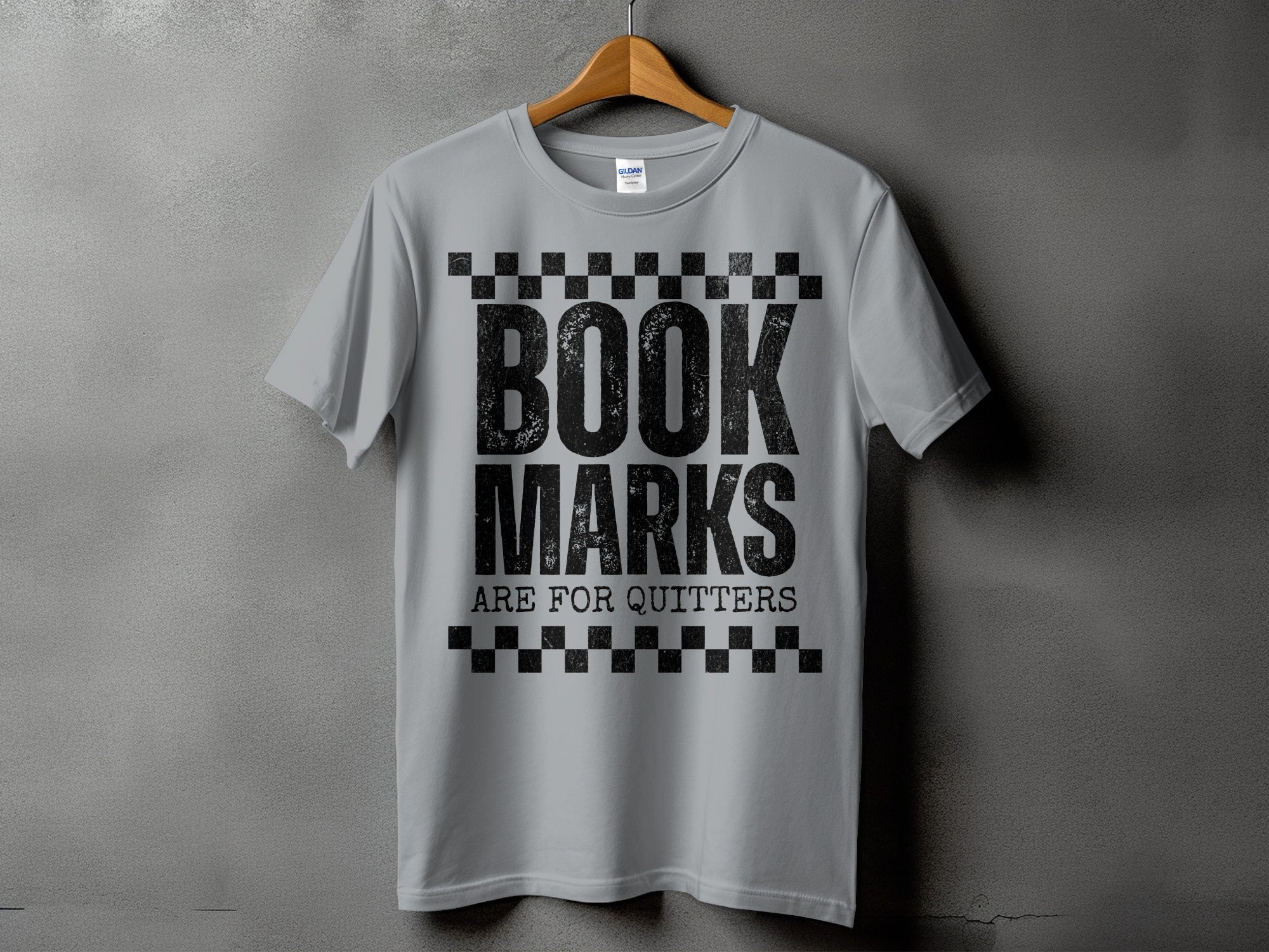 Grey t-shirt with black text that reads "BOOK MARKS ARE FOR QUITTERS".