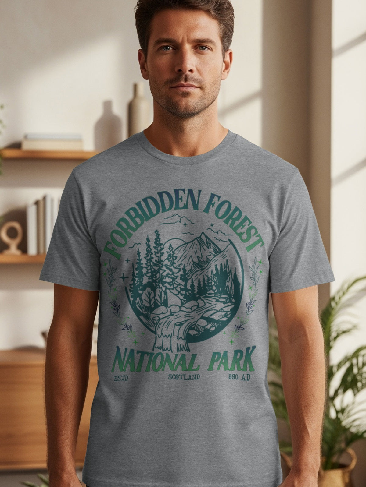 Gray t-shirt with circular graphic: "Forbidden Forest National Park," Scotland, 990 AD.