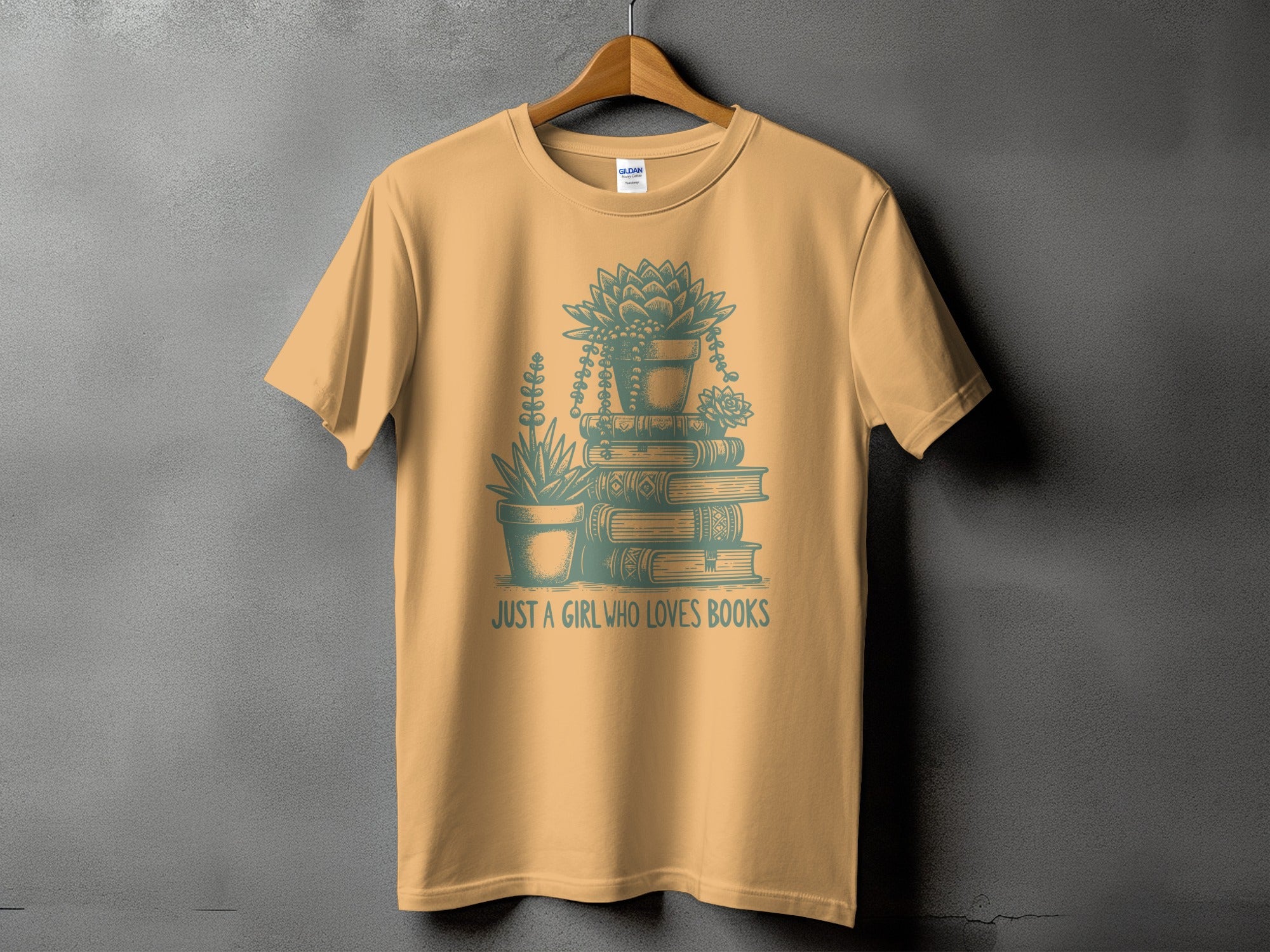 Orange t-shirt with stacked books, potted plants, and "JUST A GIRL WHO LOVES BOOKS" text.