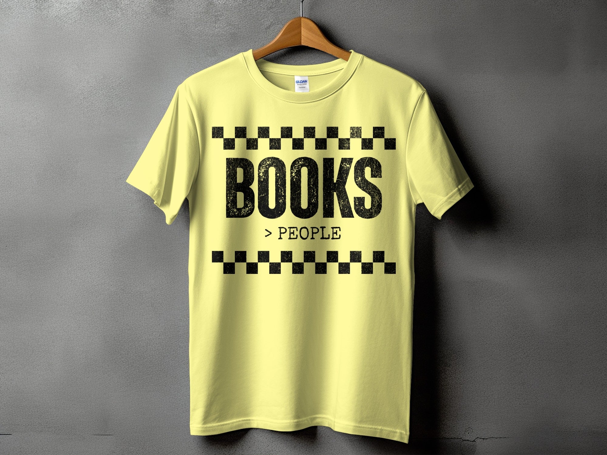 Yellow t-shirt with "BOOKS > PEOPLE" text on a grey background.
