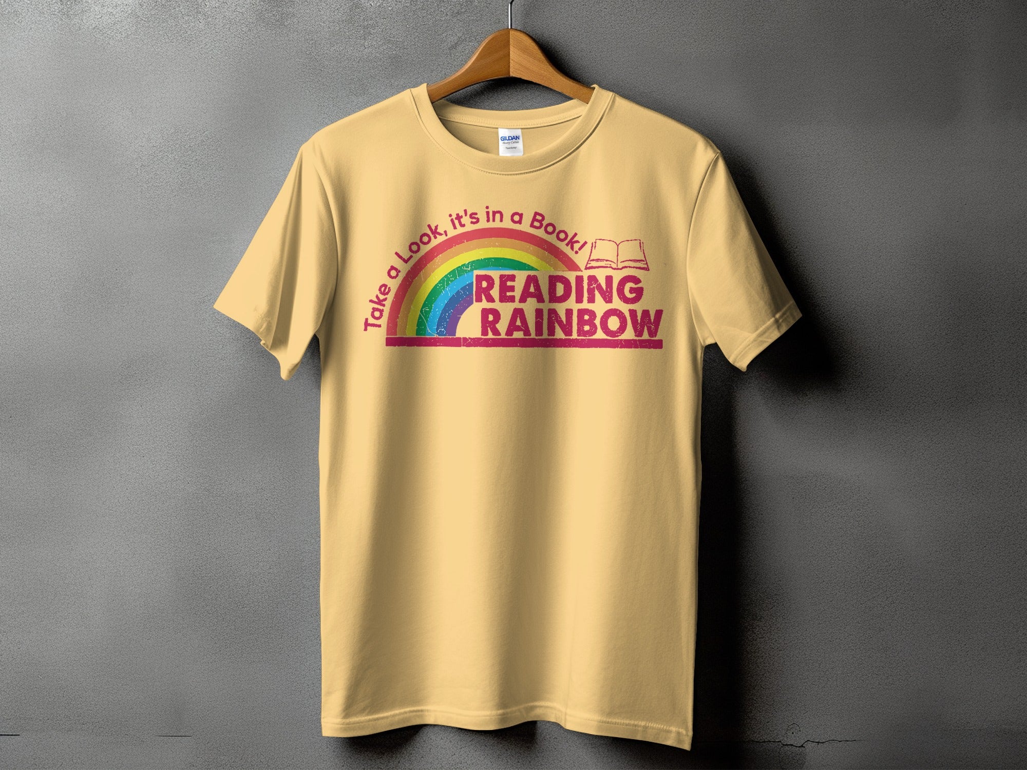 Yellow t-shirt with "Reading Rainbow" text and rainbow graphic.