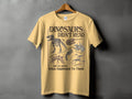Yellow t-shirt with "Dinosaurs Didn't Read" text and dinosaur skeleton illustrations.