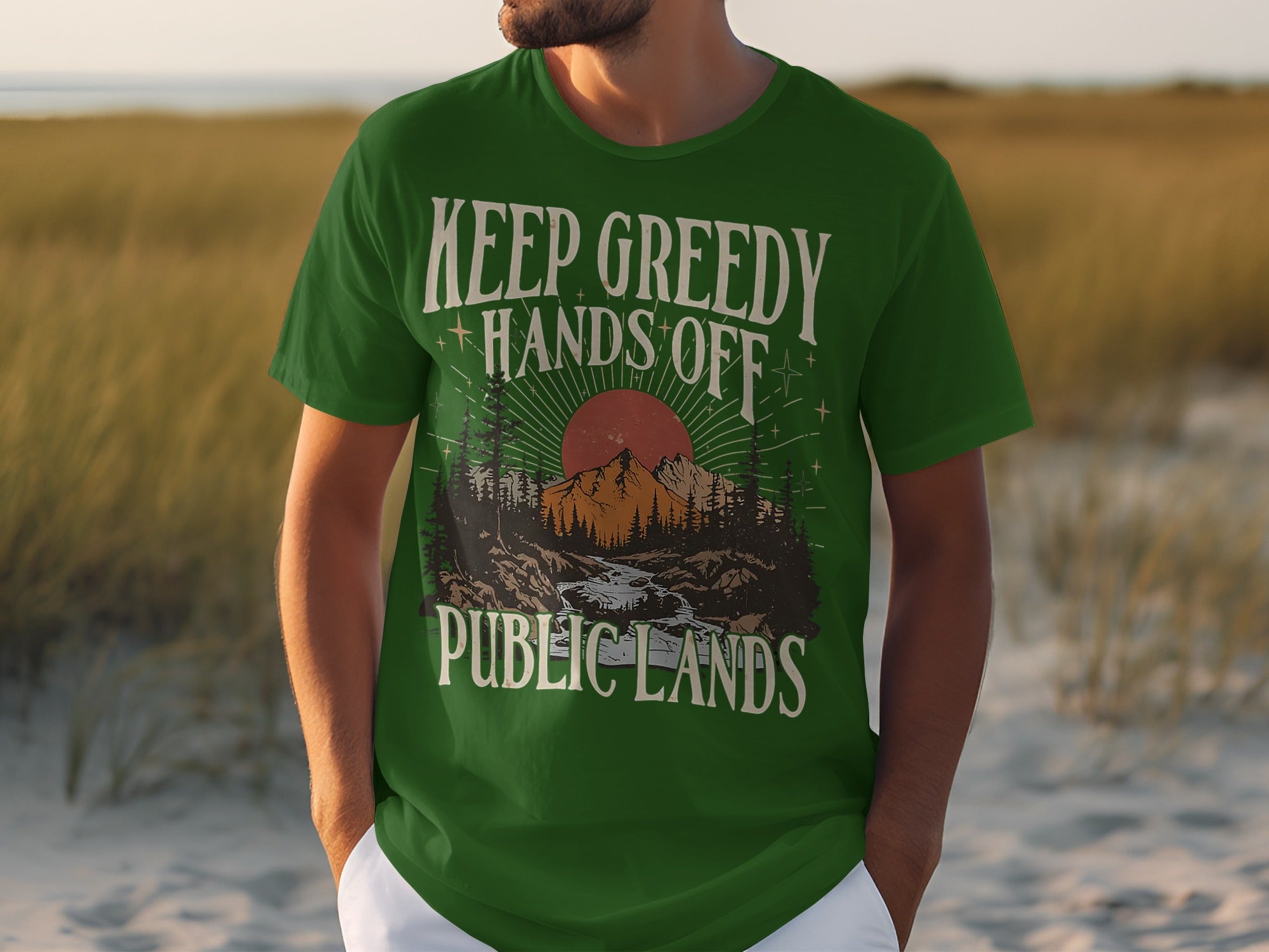Green t-shirt with "KEEP GREEDY HANDS OFF PUBLIC LANDS" graphic.