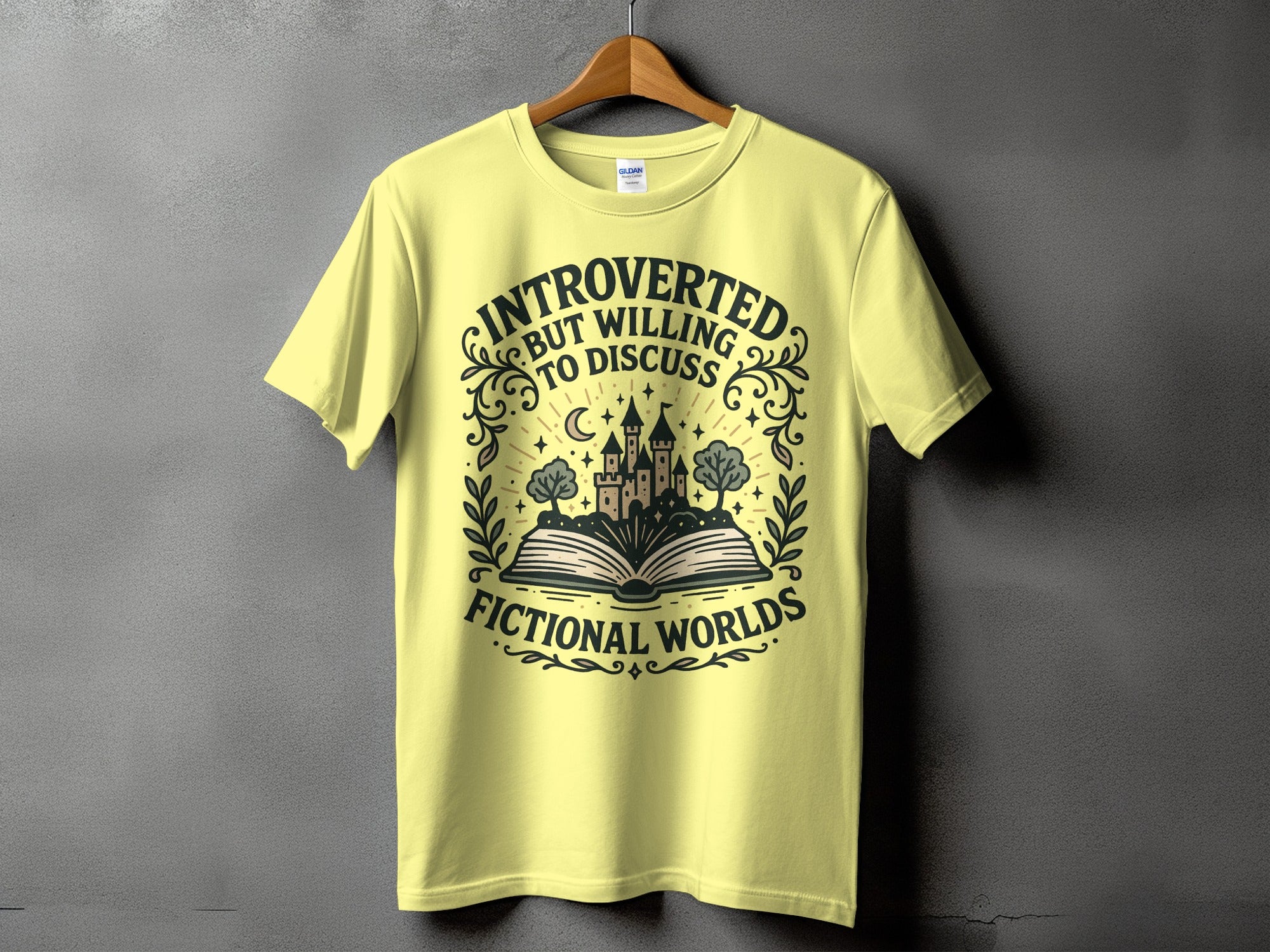 Yellow t-shirt with "Introverted but willing to discuss fictional worlds" text and castle graphic.