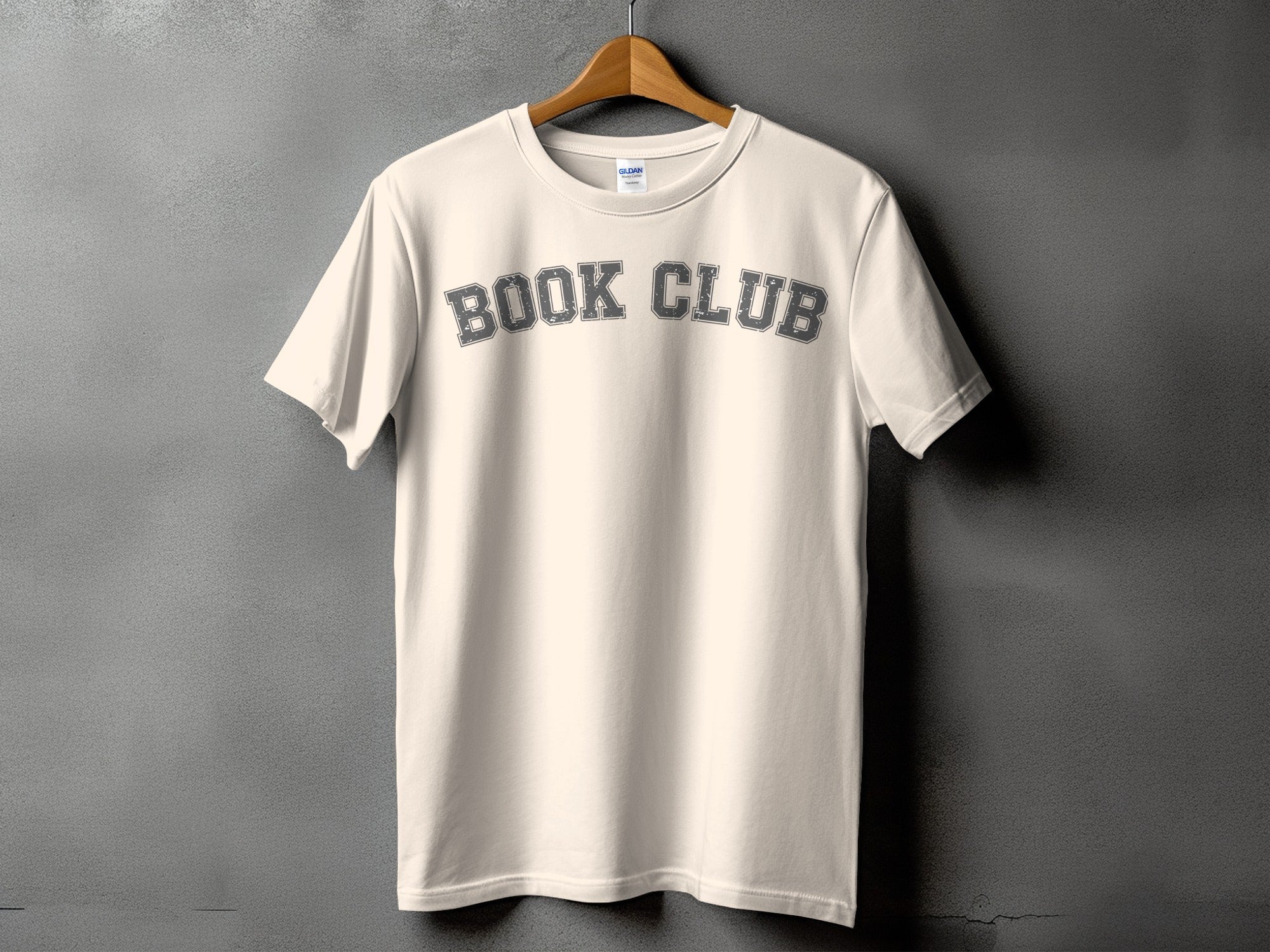 Light cream t-shirt with "BOOK CLUB" text in distressed gray lettering.