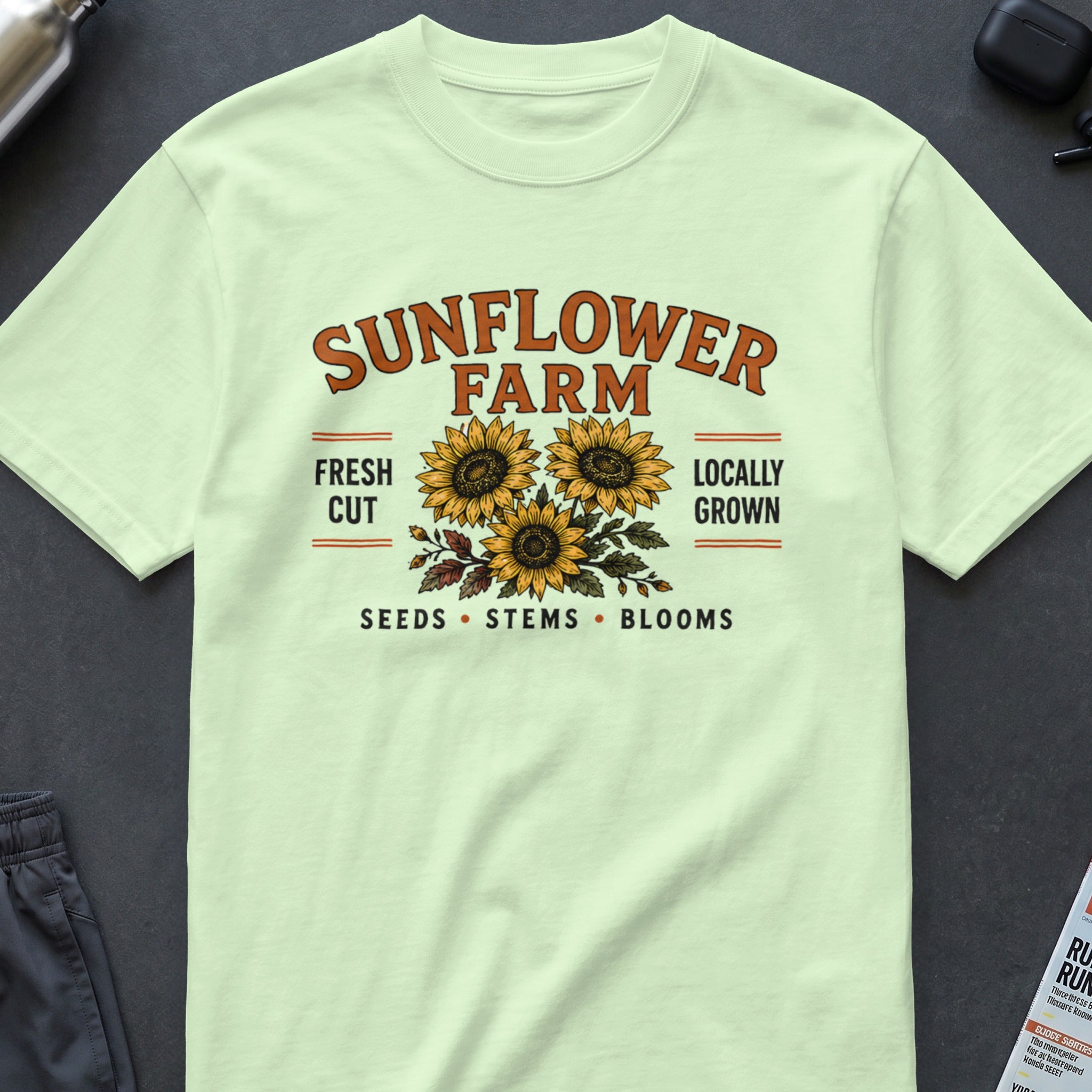 Light green t-shirt with "Sunflower Farm" text and three sunflowers design.
