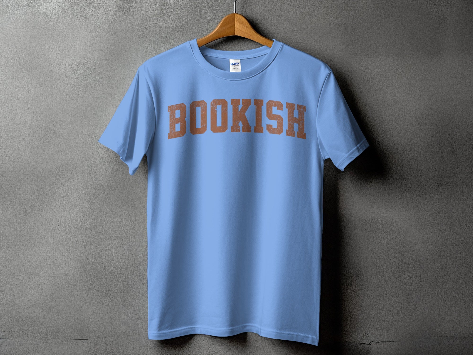 Light blue t-shirt with distressed "BOOKISH" text in rustic orange.