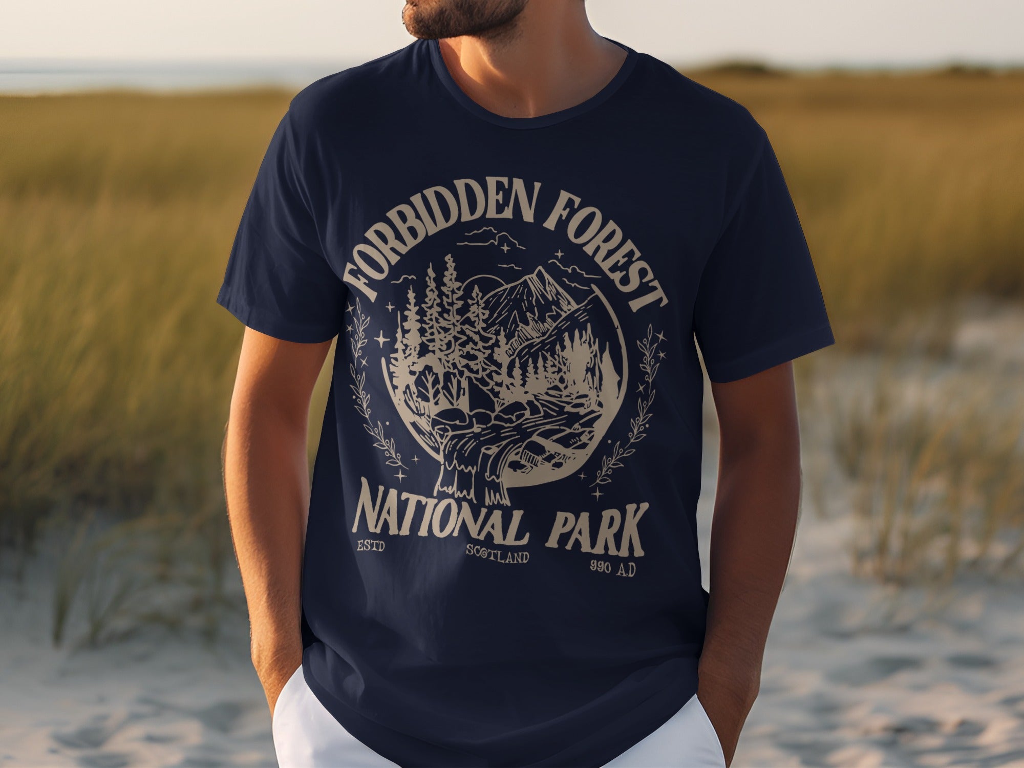 Navy t-shirt with "Forbidden Forest National Park Scotland 990 AD" graphic.